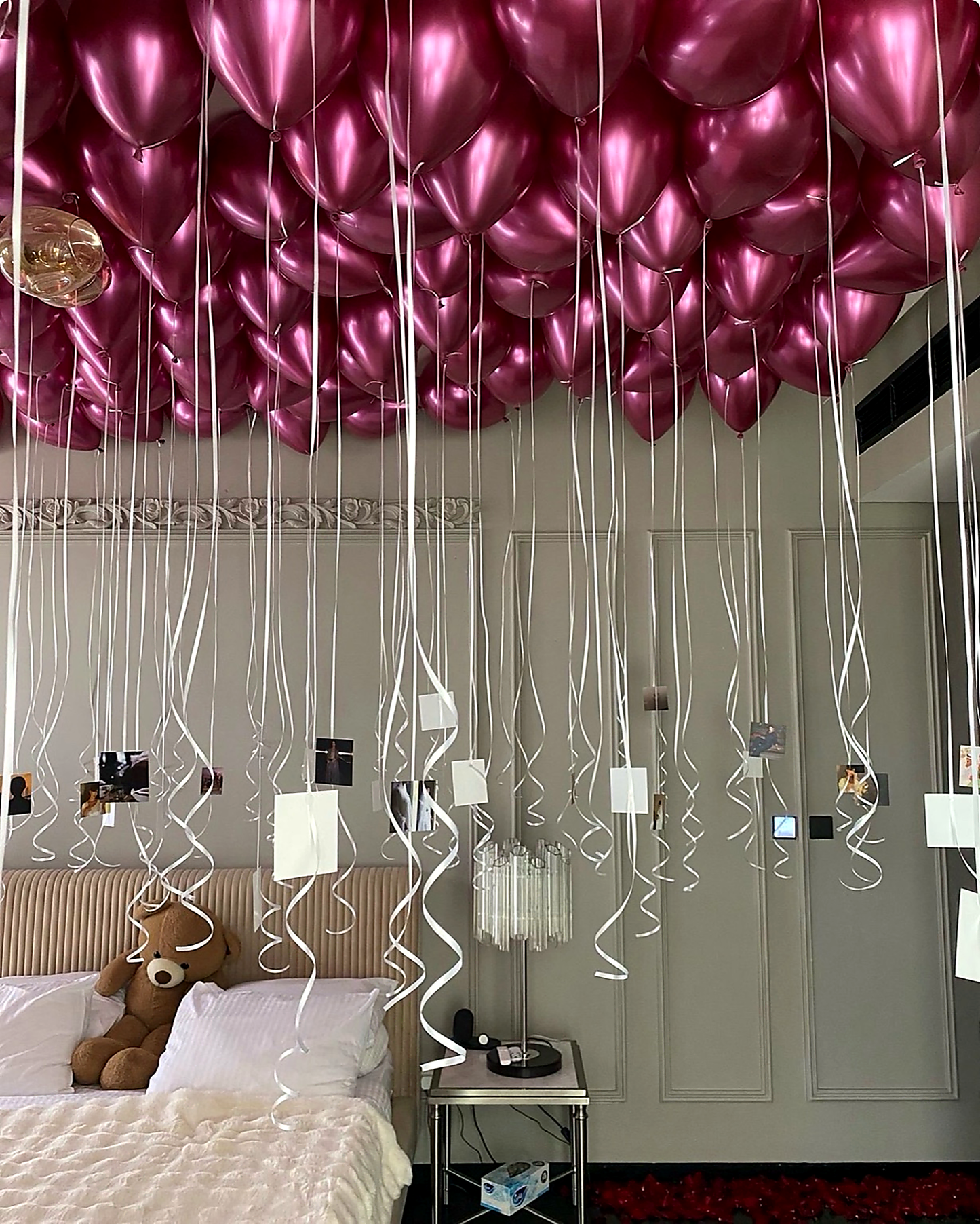 Fuchsia helium ceiling balloons with hanging printed photos in New York City
