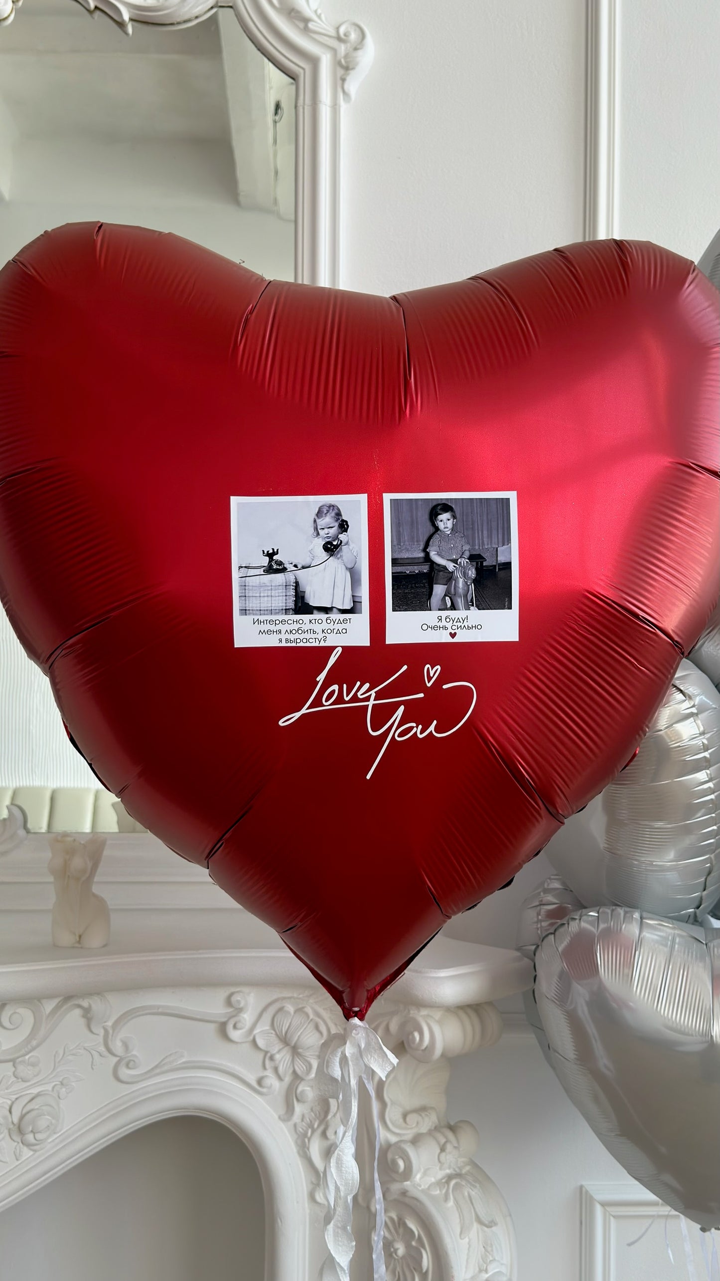 Close-up of red heart balloon with custom photos and metallic balloon styling for romantic event decor in Manhattan
