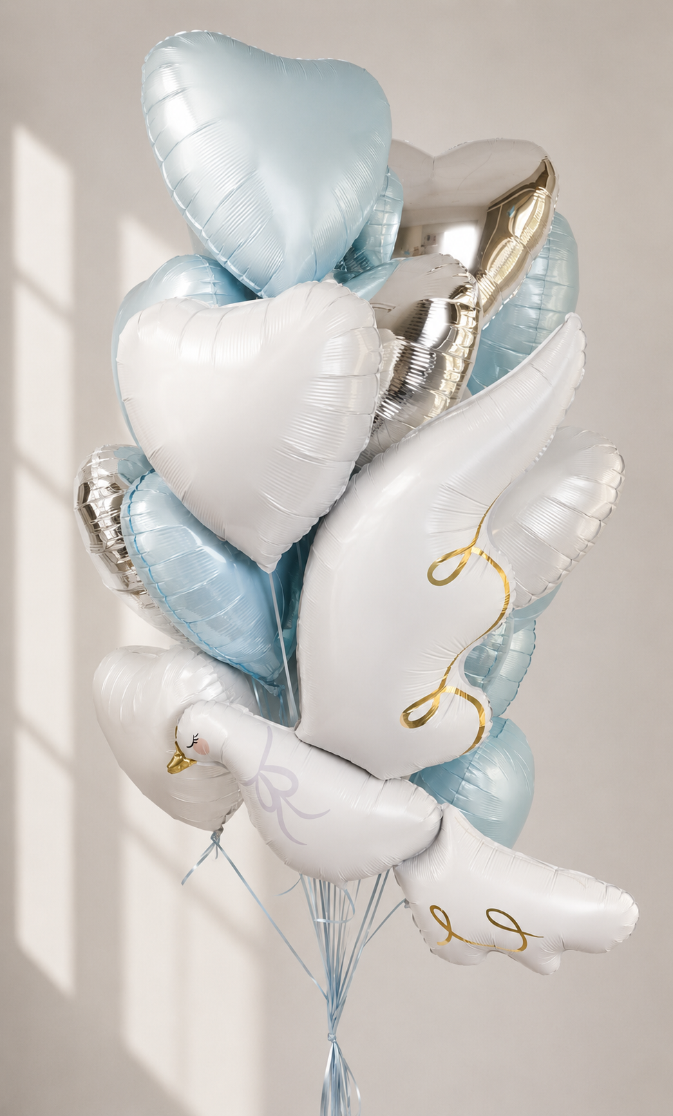Blue Dove and Heart Balloon Bouquet featuring 1 pigeon balloon and 14 heart balloons for First Communion and elegant celebration decor in Brooklyn