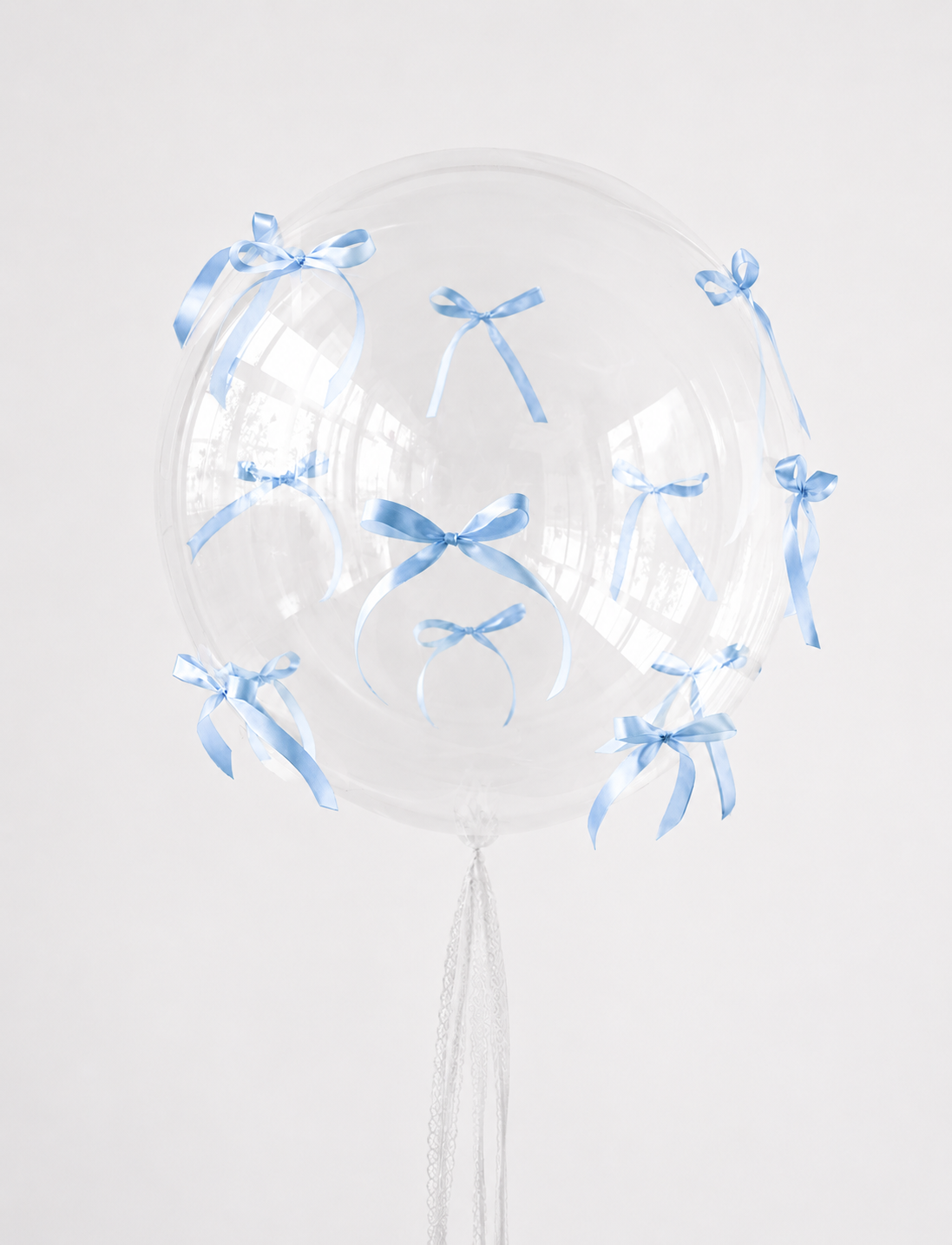 Bubble Balloon with Bows featuring a clear bubble balloon with blue ribbon bows for elegant celebration decor in NYC