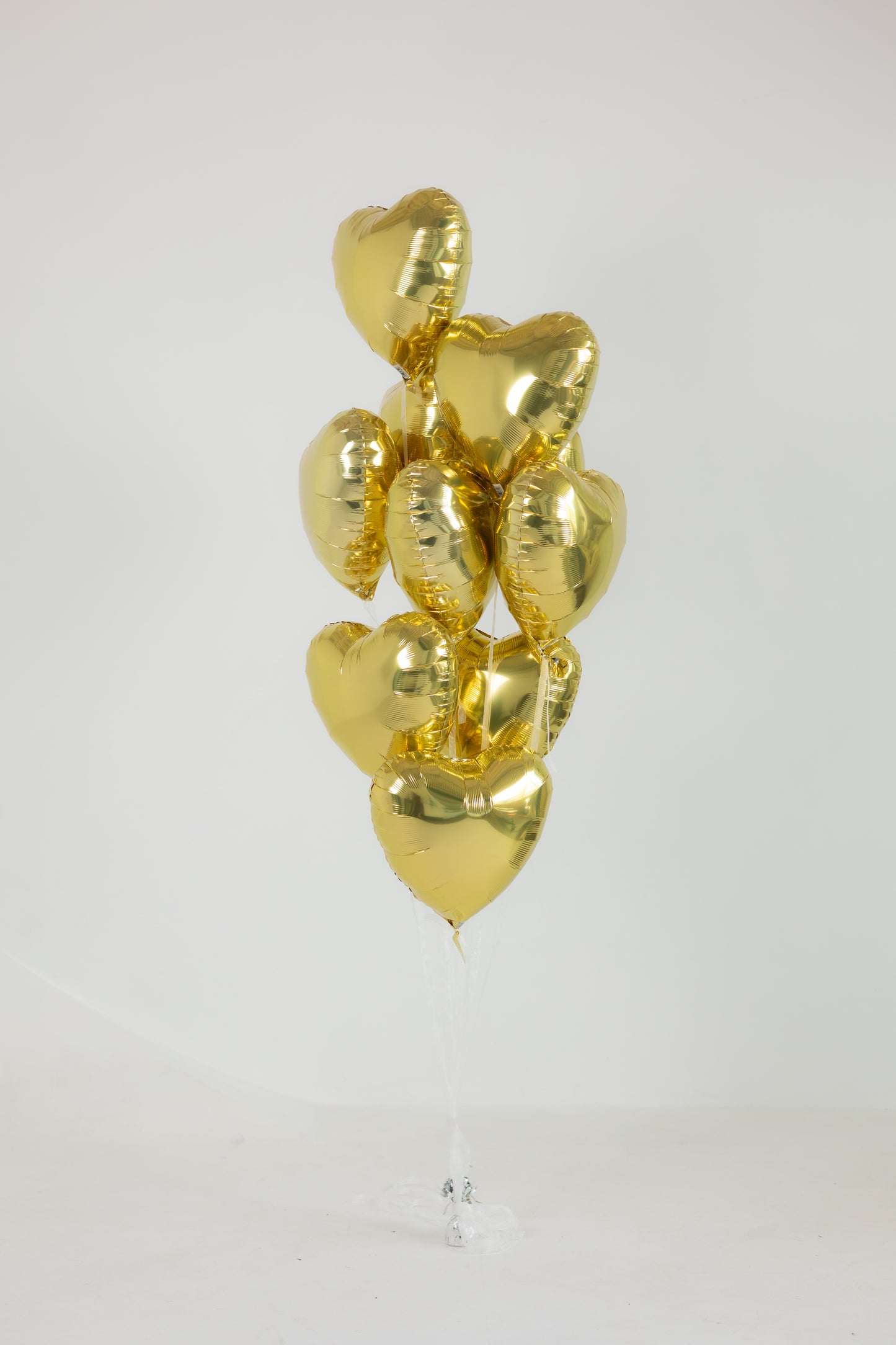 Bunch of Hearts balloon bouquet with 10 gold foil heart balloons for romantic decor in New York
