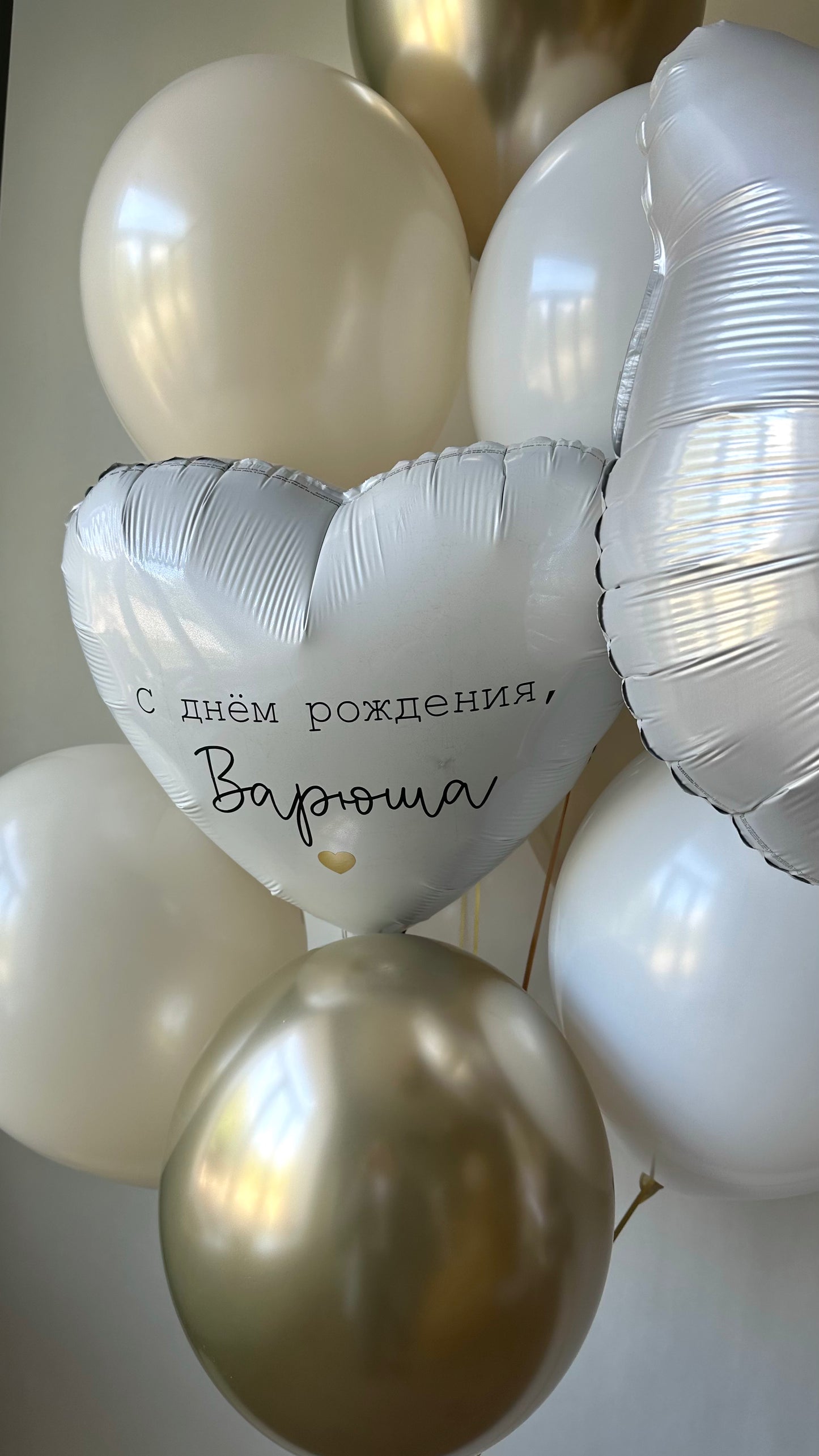 White and gold cat themed balloon decor for elegant birthday party in Manhattan