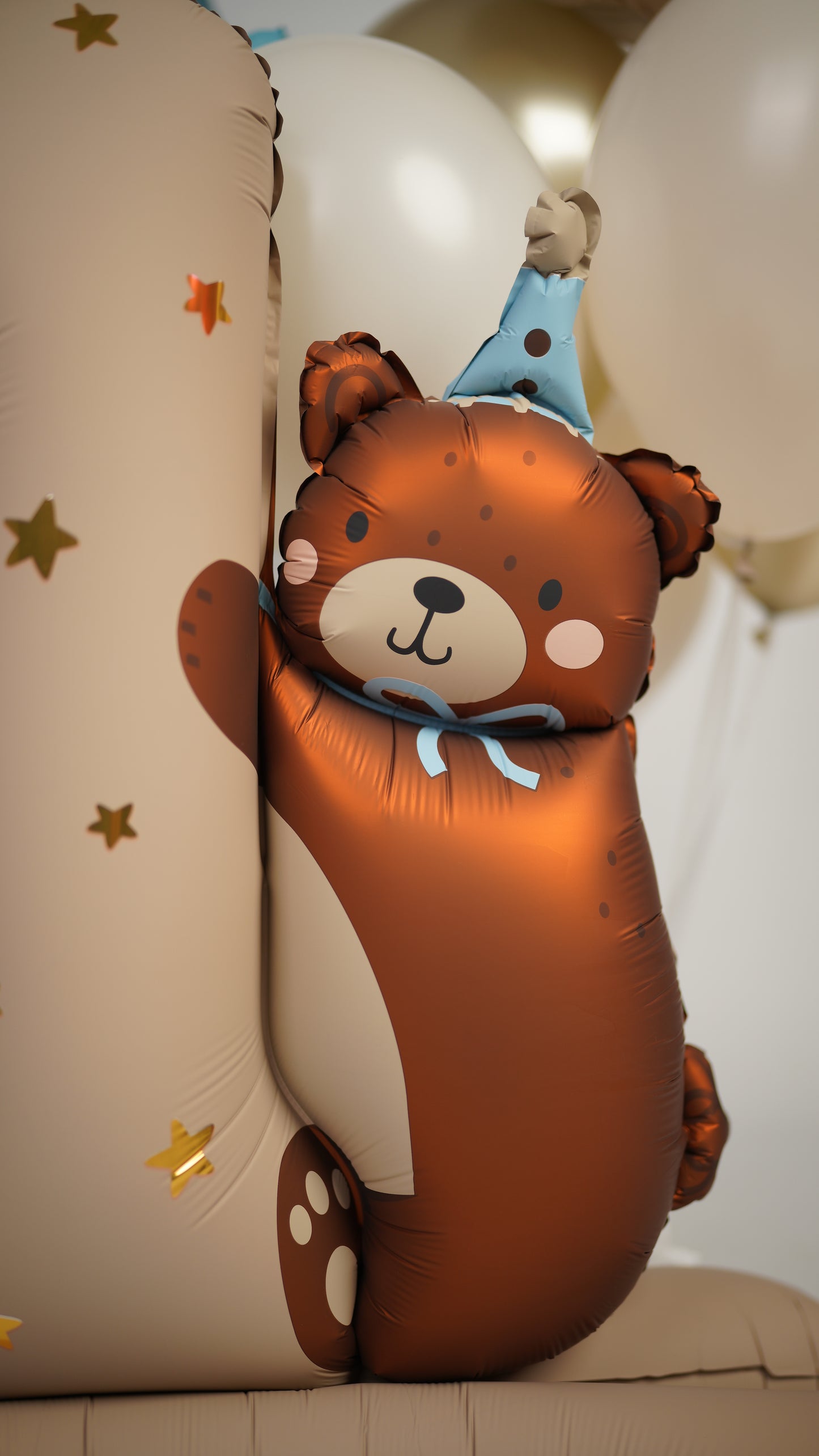 Close-up of first birthday bear balloon decor with one balloon and neutral party styling in Brooklyn