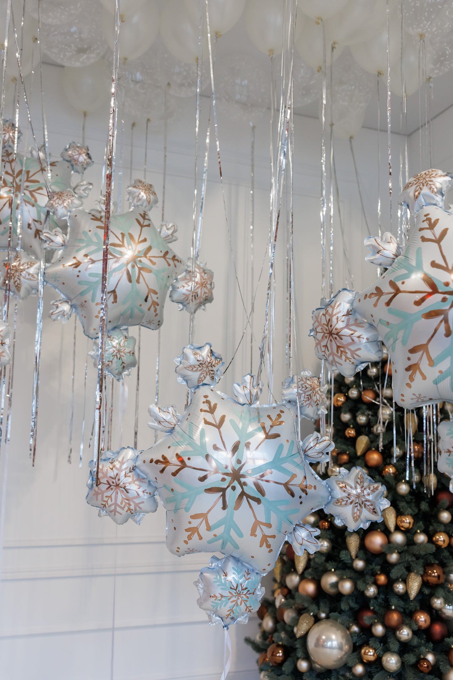 Elegant Christmas balloon setup with snowflake balloons and white ceiling decor in Manhattan