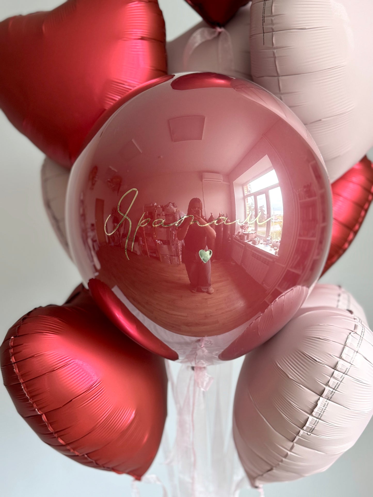 Close-up of personalized bubble balloon with layered heart balloons for romantic decor in Manhattan