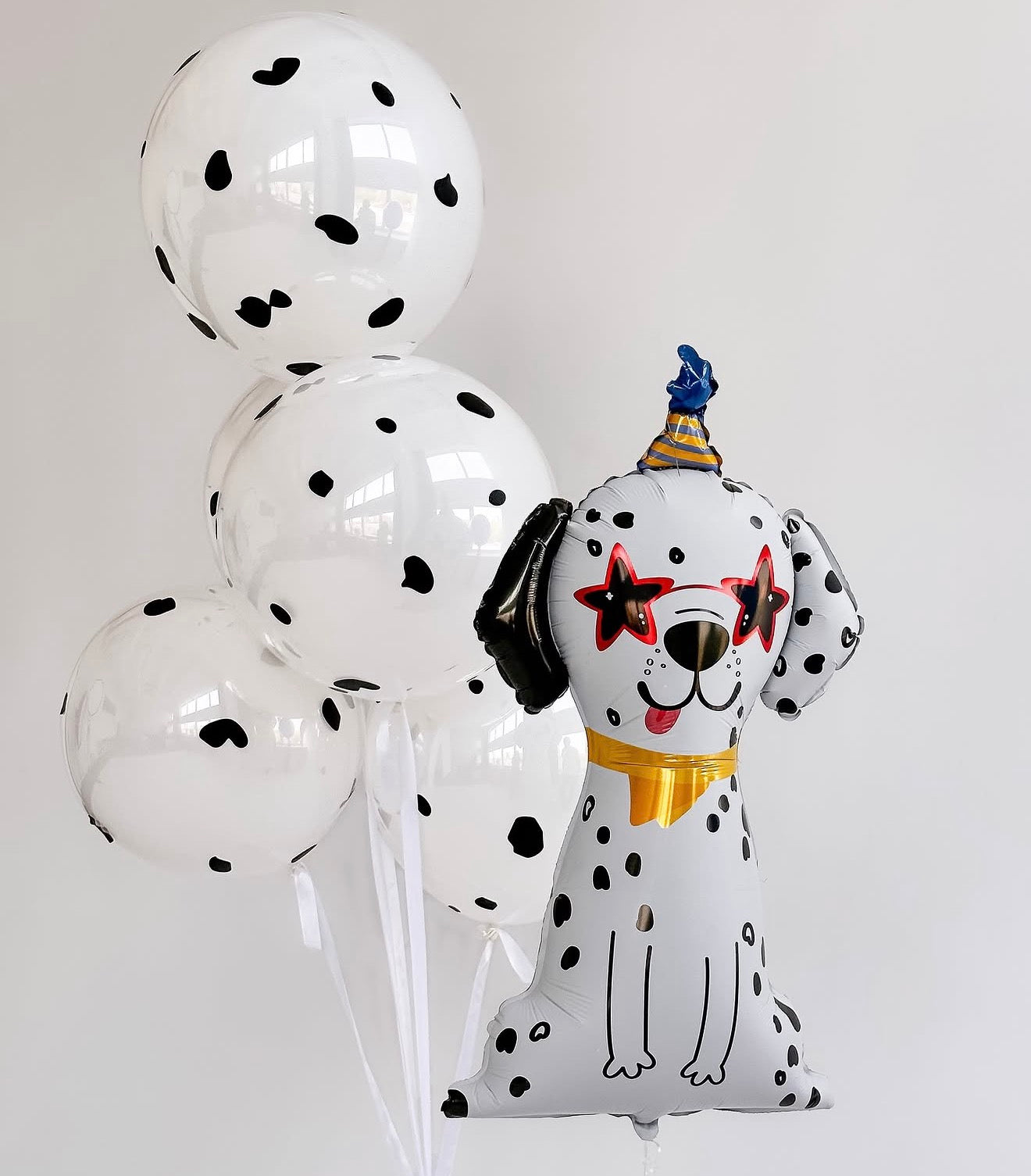Party Pup balloon set with dalmatian dog balloon and bubble balloons with black decals for kids party decor in Jersey City