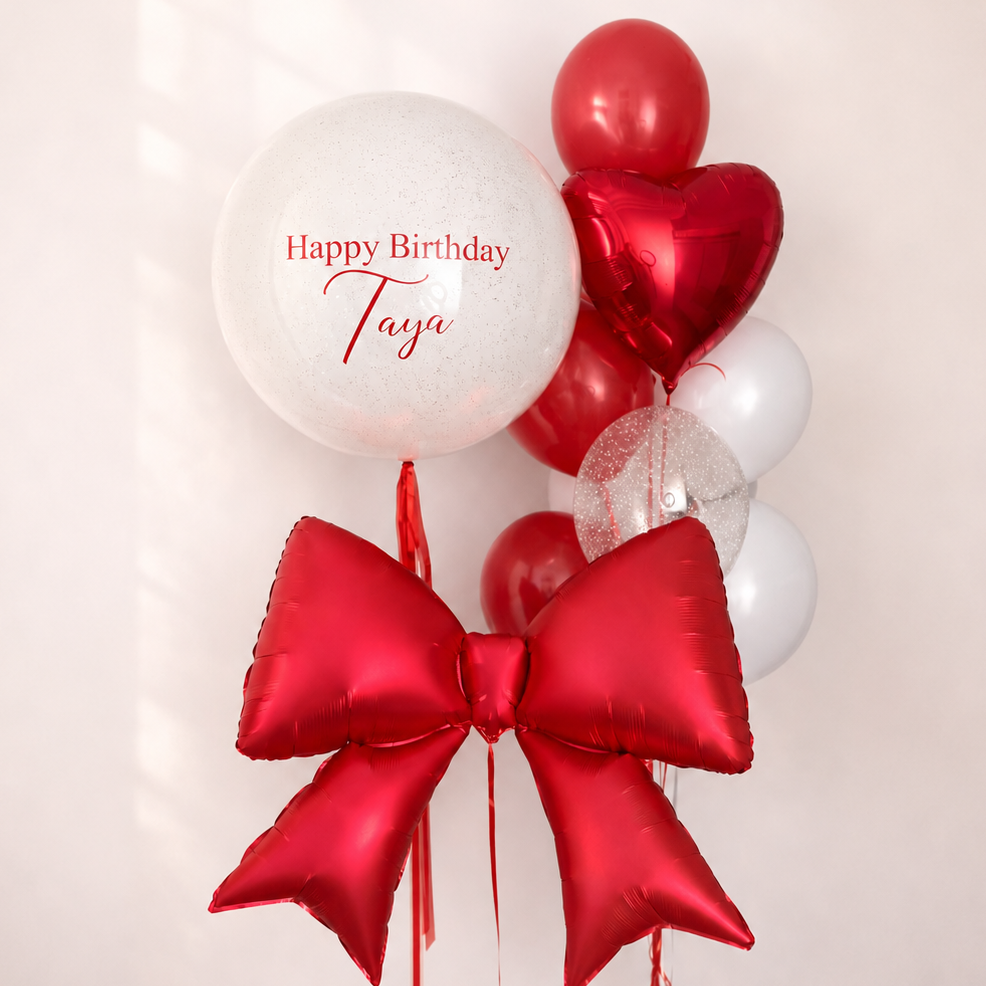 Ruby Bow Balloon Set with custom bubble balloon, large red bow balloon, red heart balloon, and coordinating latex balloons for birthday celebrations in Brooklyn