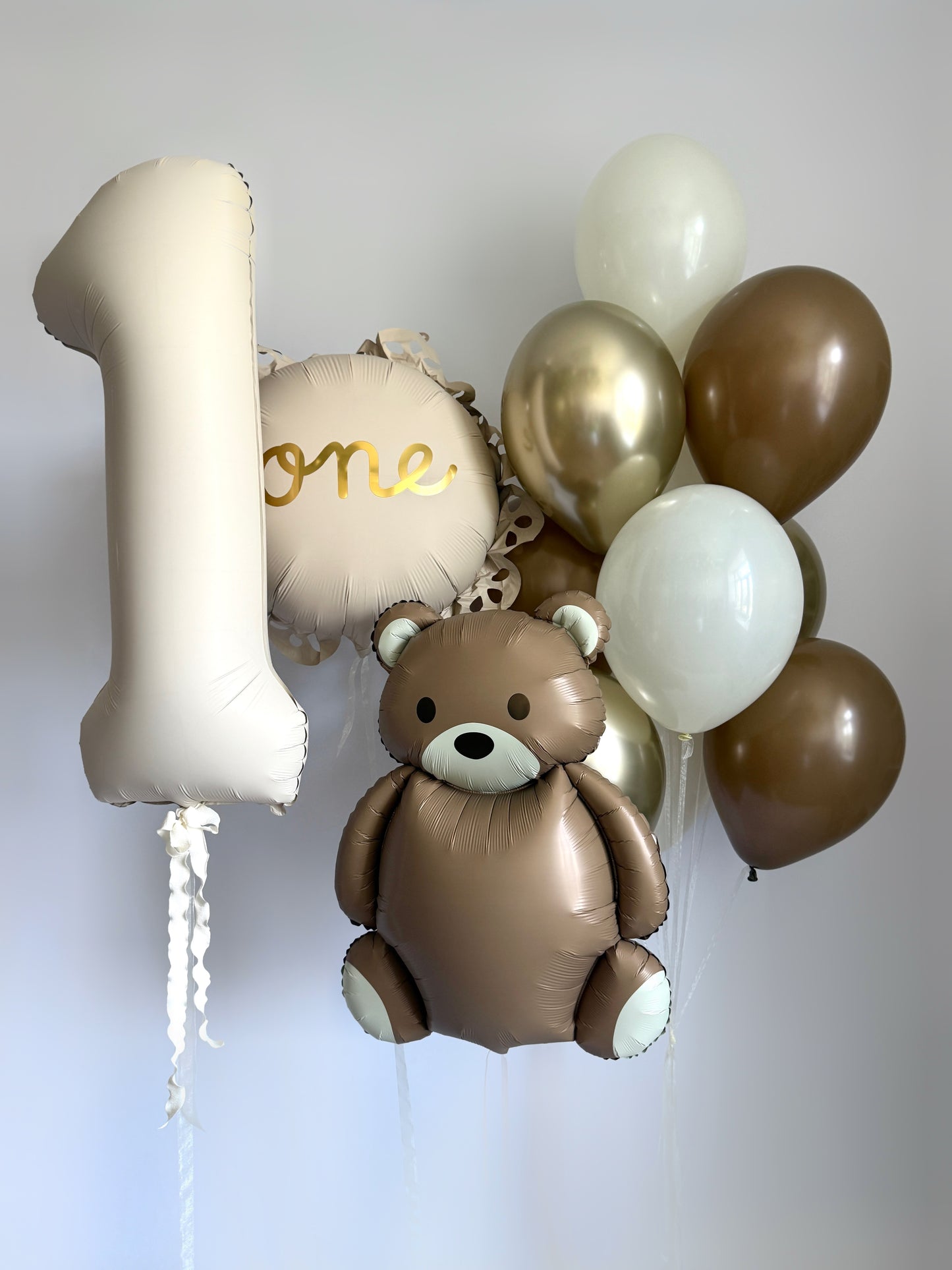 Something to remember balloon set with teddy bear balloon, number balloon, and first birthday decor in New York