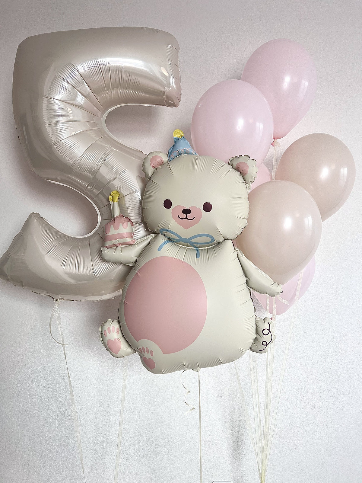 Sweet Teddy birthday balloon set with a silver number 5, a cream foil teddy bear holding a birthday cake, and pastel pink and cream latex balloons.