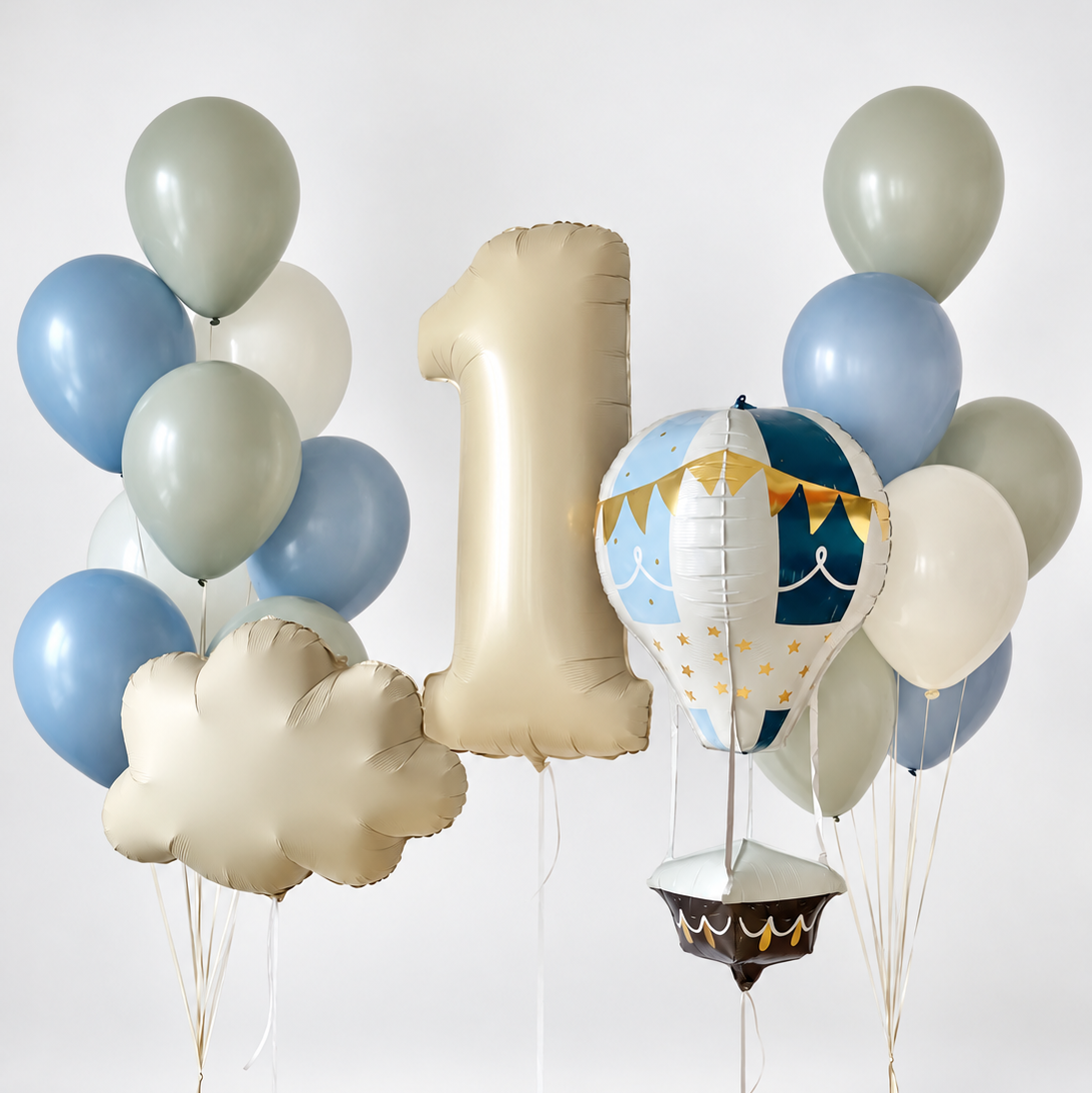 Cream number one and cloud balloons with a blue and white hot air balloon, framed by two bunches of blue, cream and sage green latex balloons.