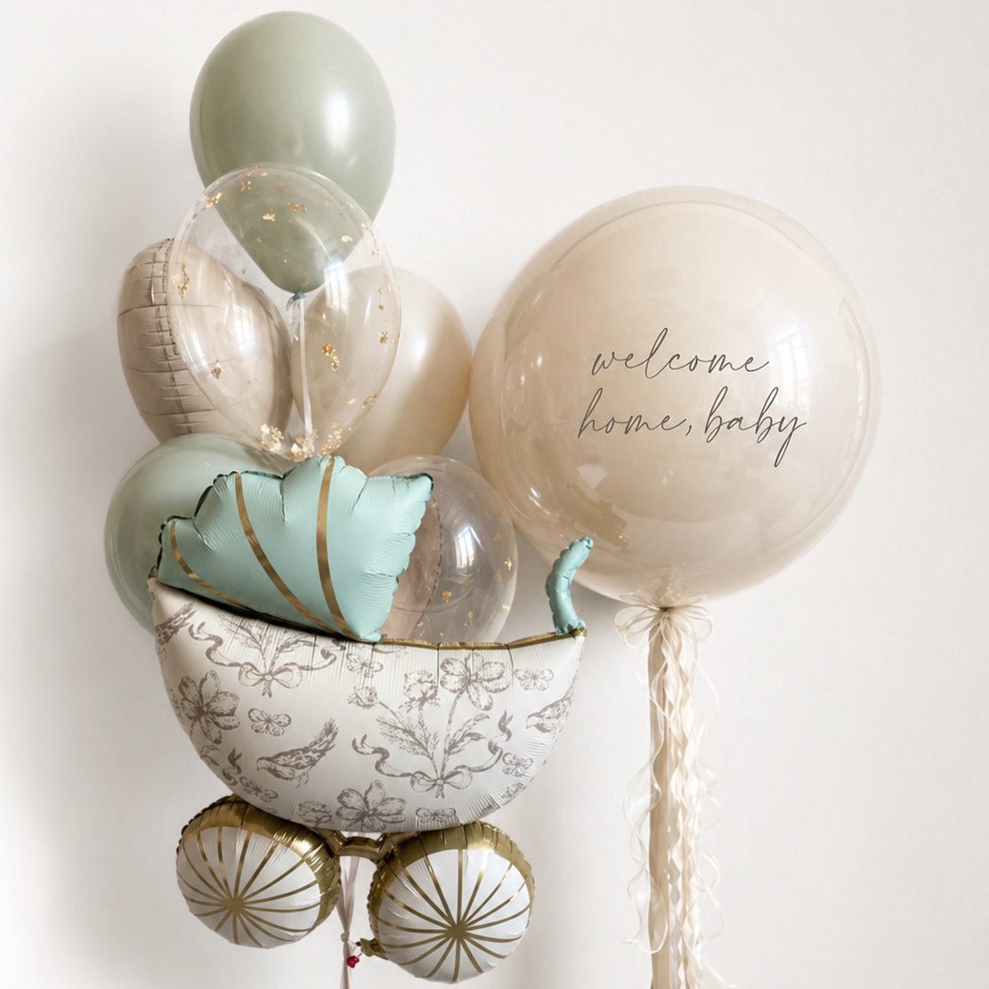 Welcome Home Baby Stroller Balloon Set in Brooklyn with a personalized bubble balloon, stroller balloon, and coordinating bunch of heart, clear, and latex balloons