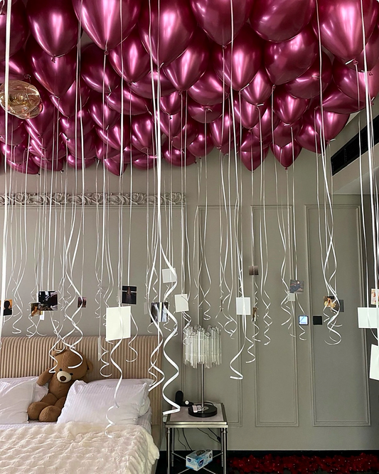 Fuchsia helium ceiling balloons with hanging printed photos in New York City
