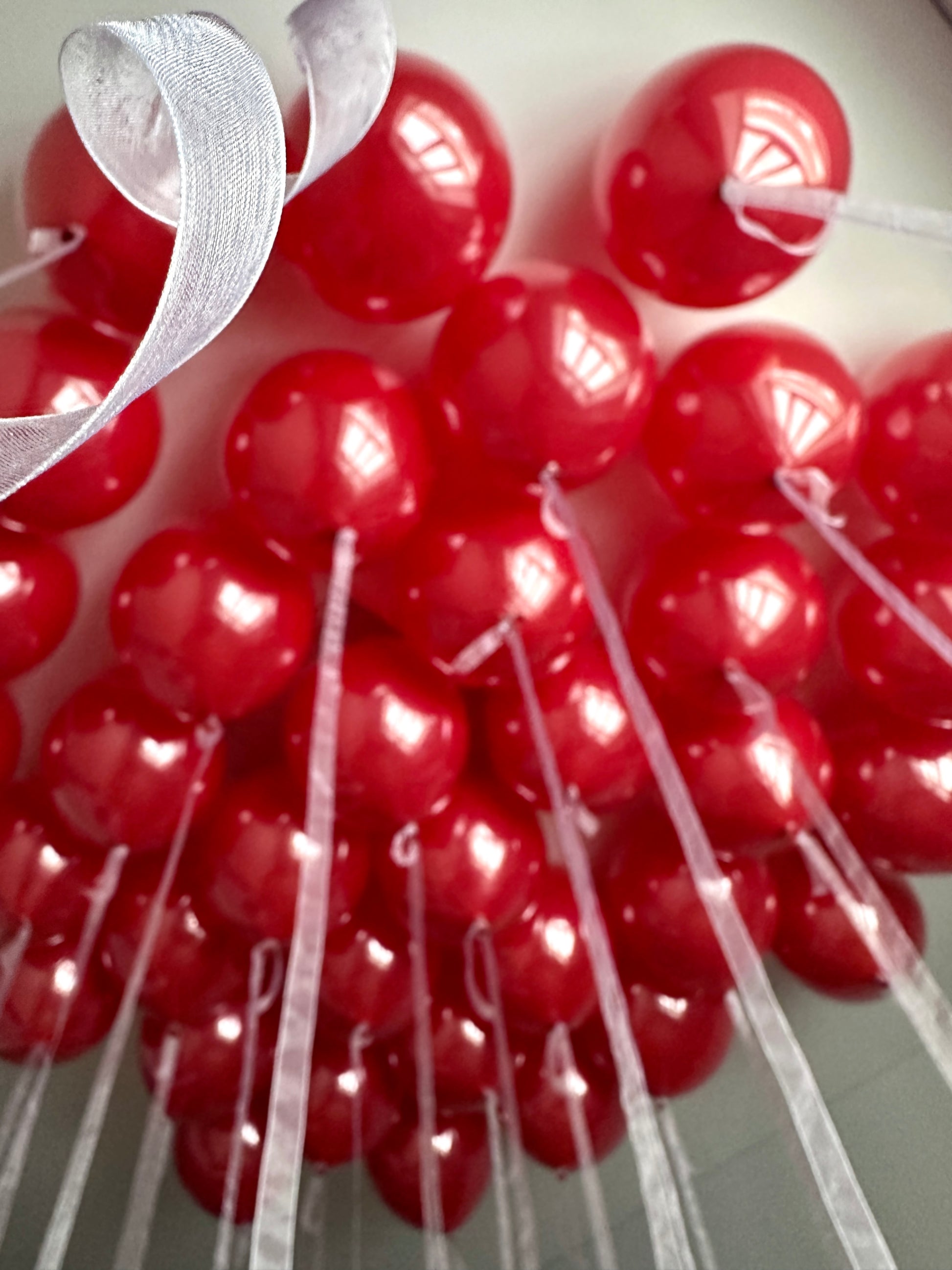 Close-up of red medium bubble balloons styled as a luxury installation in Manhattan