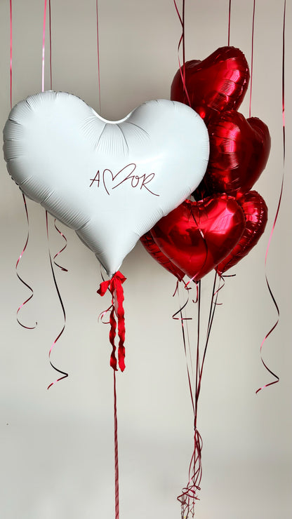 Red and white heart balloon bouquet with custom sign for romantic decor in New York