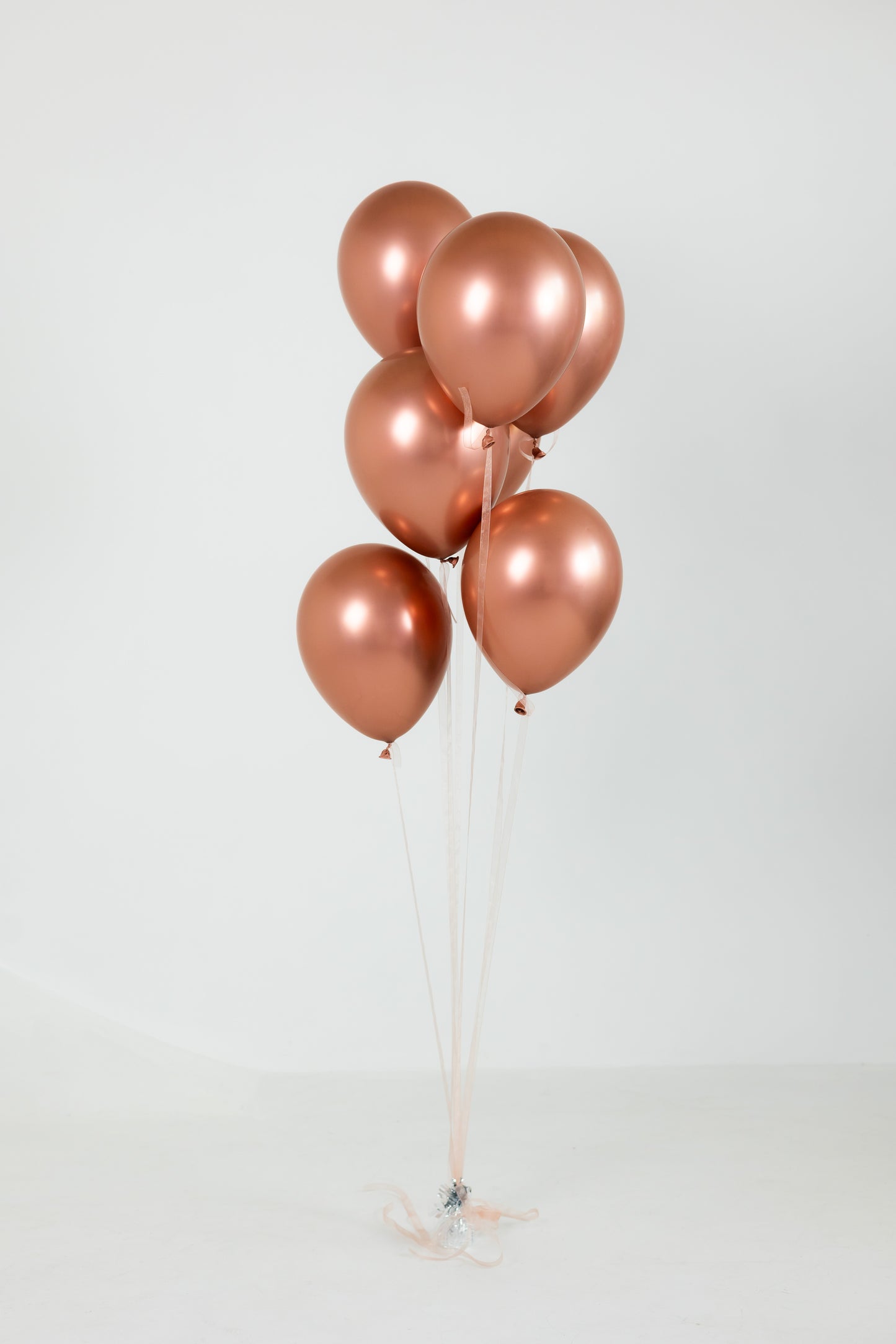 7 latex balloon bouquet in champagne tones for birthday and event decor in Brooklyn