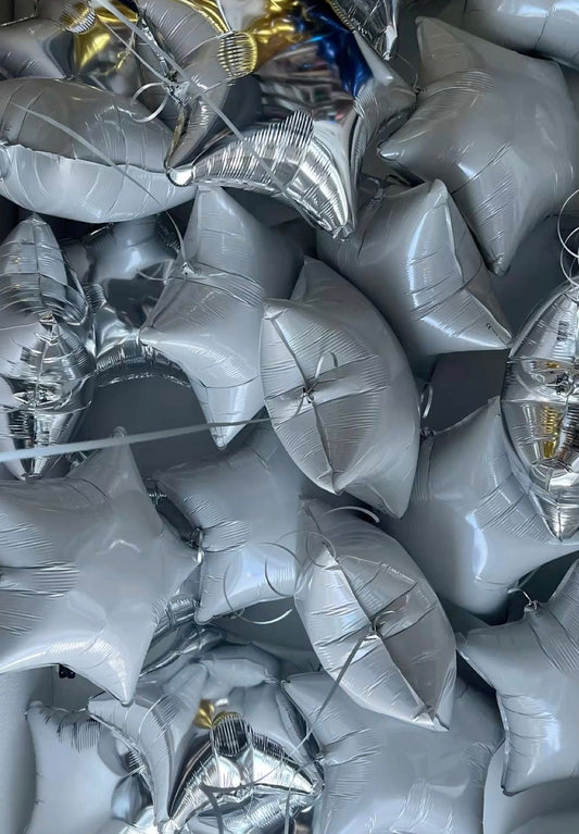 Metallic star-shaped helium ceiling balloons in New York City
