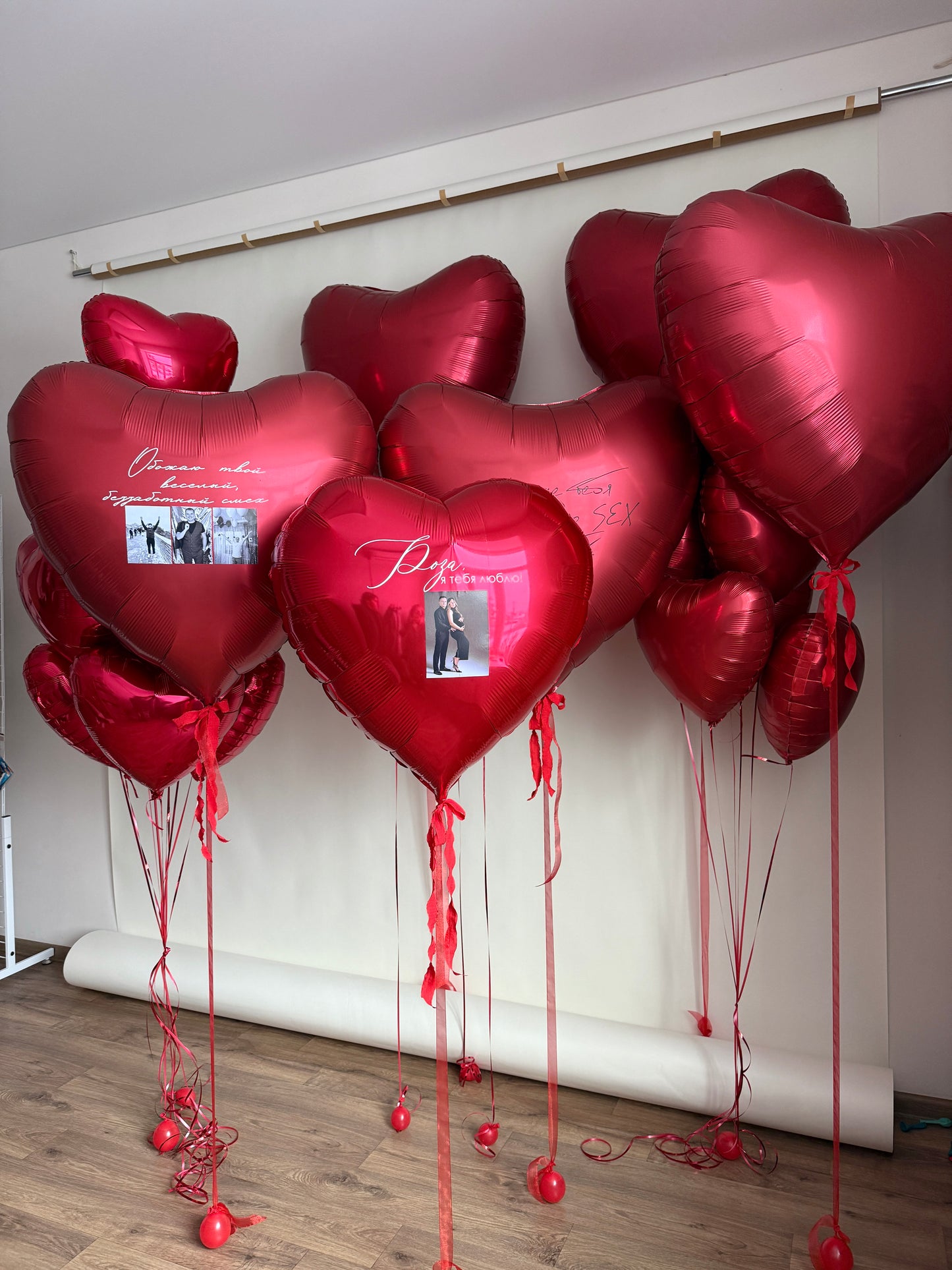 Luxury heart balloon installation with personalized photos and custom sign for romantic decor in New York