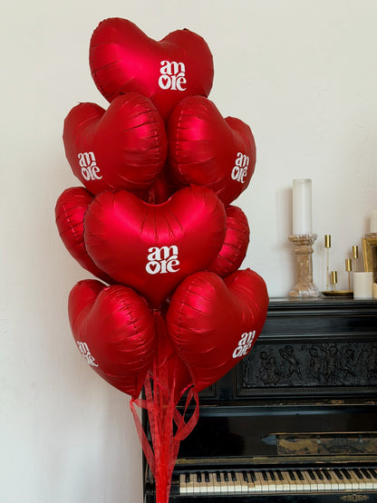 Red heart helium balloon arrangement for romantic room decor in Brooklyn