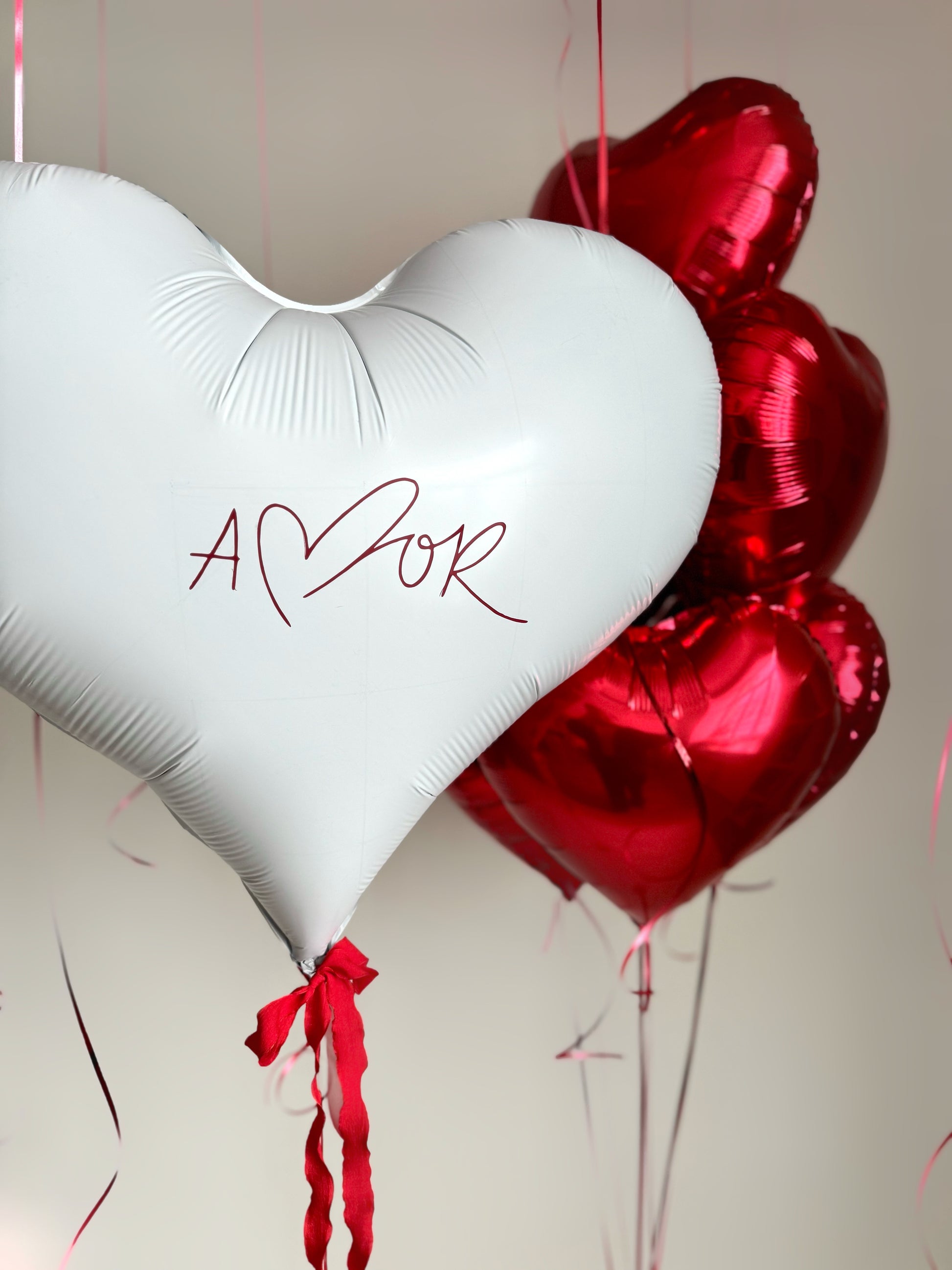 Close-up of custom sign heart balloon with red heart bouquet for celebration decor in Queens