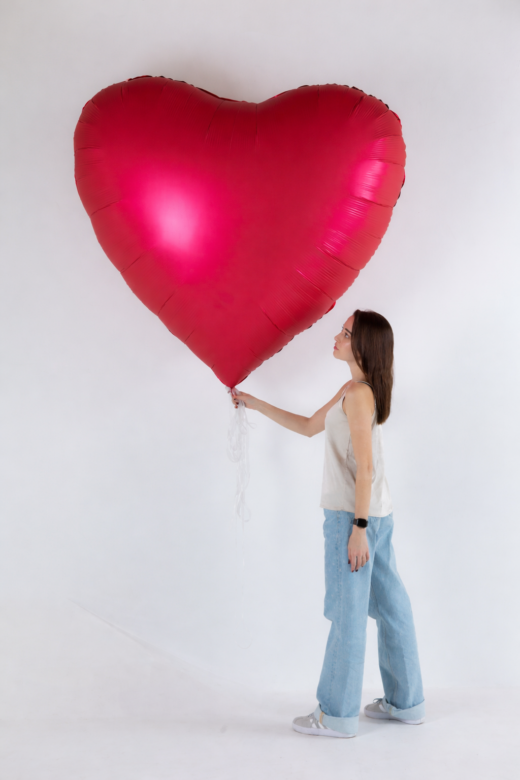 Oversized red heart helium balloon for romantic event decor in Manhattan