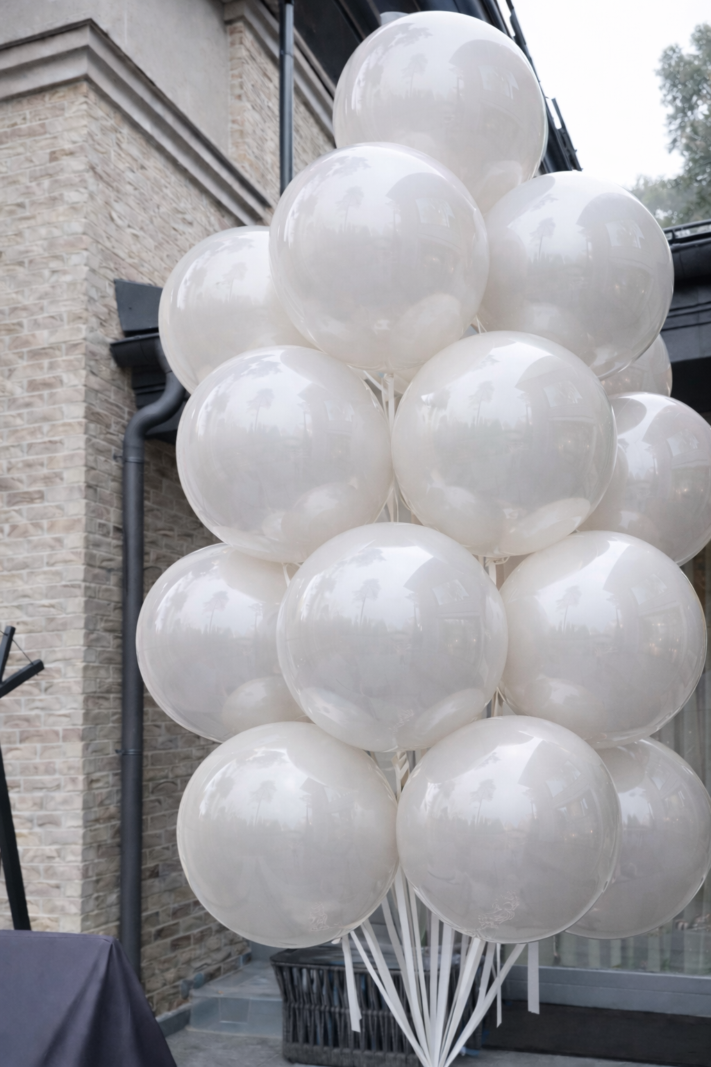 White double bubble balloon bouquet for elegant event decor in Queens