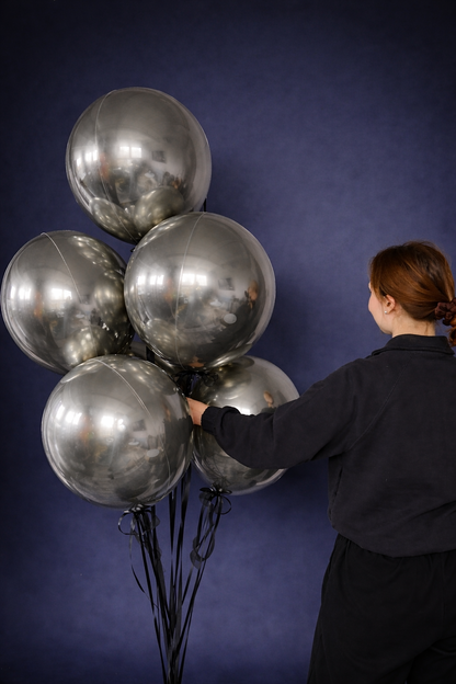 White gold bubble balloon bouquet styled for luxury celebration decor in Brooklyn