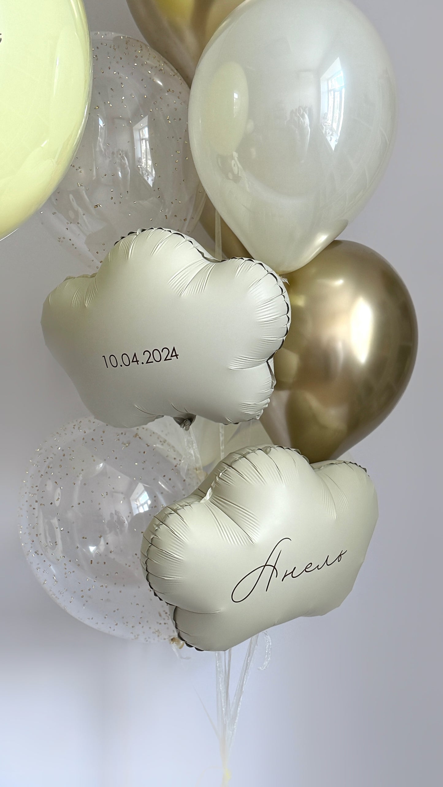 Baby welcome balloon decor with cloud balloons, teddy bear balloon, and soft neutral styling in Manhattan