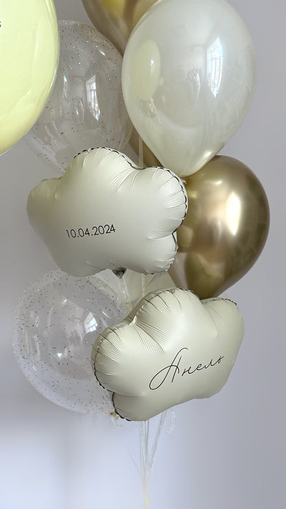 Baby welcome balloon decor with cloud balloons, teddy bear balloon, and soft neutral styling in Manhattan