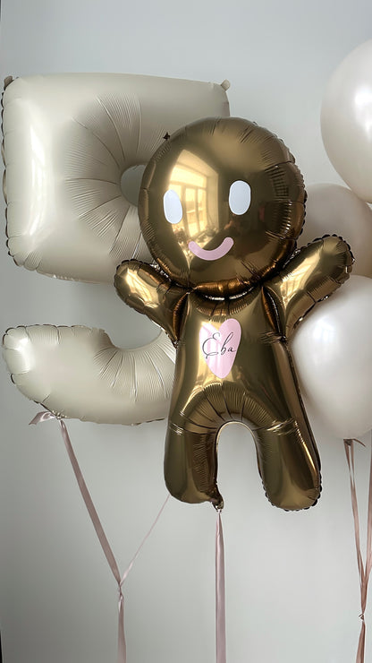 Detail of gingerbread balloon with number balloon for festive kids birthday decor in Queens