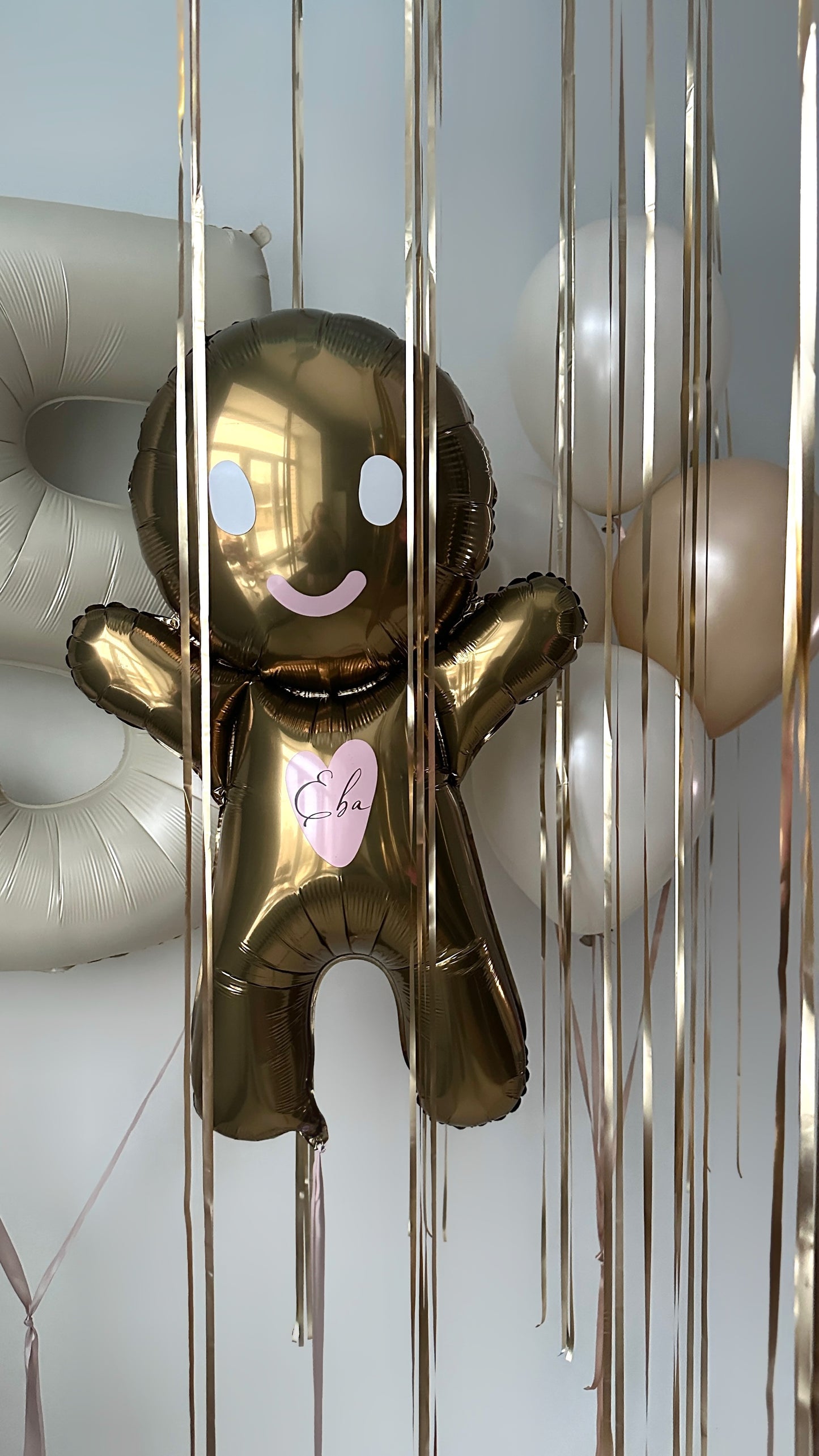 Gingerbread birthday balloon decor with neutral latex balloons for celebration styling in Manhattan