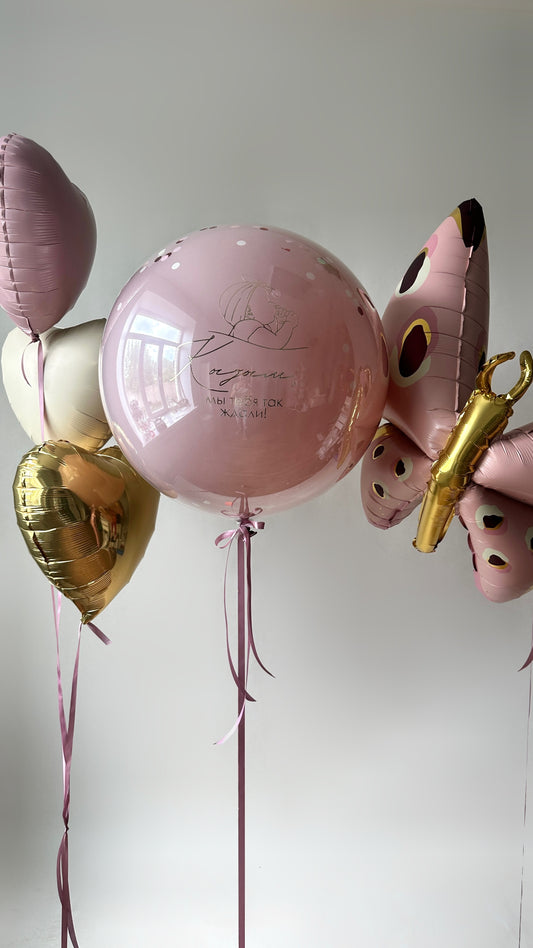 Baby welcome balloon decor with custom bubble balloon and butterfly foil balloon in Brooklyn