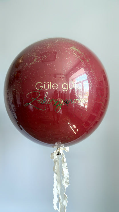 Bachelorette custom bubble balloon with burgundy finish and personalized sign for party decor in New York