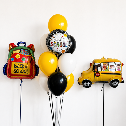 Back to School balloon set with a bouquet of yellow, black and white balloons, a round back to school foil balloon, a school bus foil balloon and a backpack foil balloon in Brooklyn