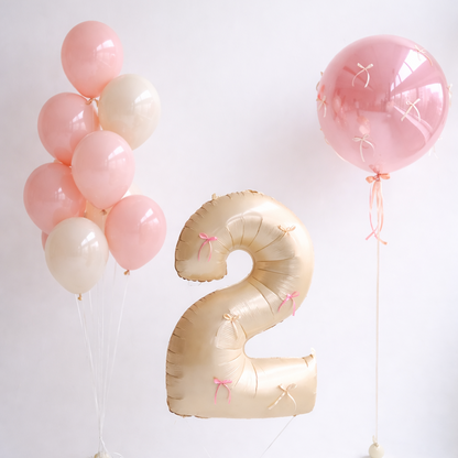 Bow Number Balloon Set with number balloon, bow bubble balloon, and glass balloon bunch in pink tones for birthday decor in Brooklyn