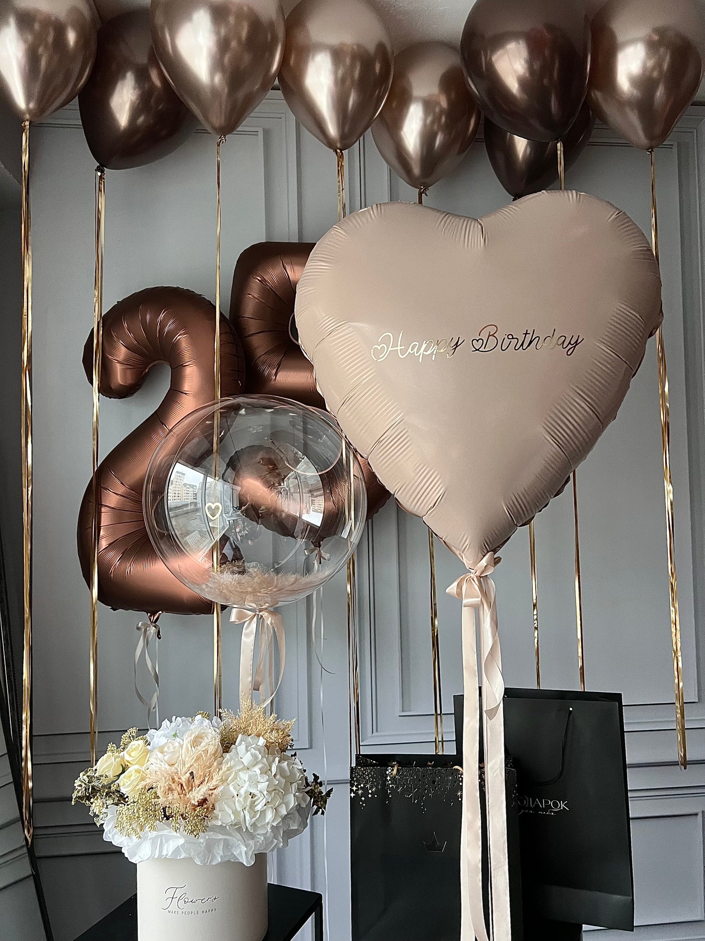 Bronze birthday balloon set with number balloons, heart balloon with sign, and feather bubble balloon in New York