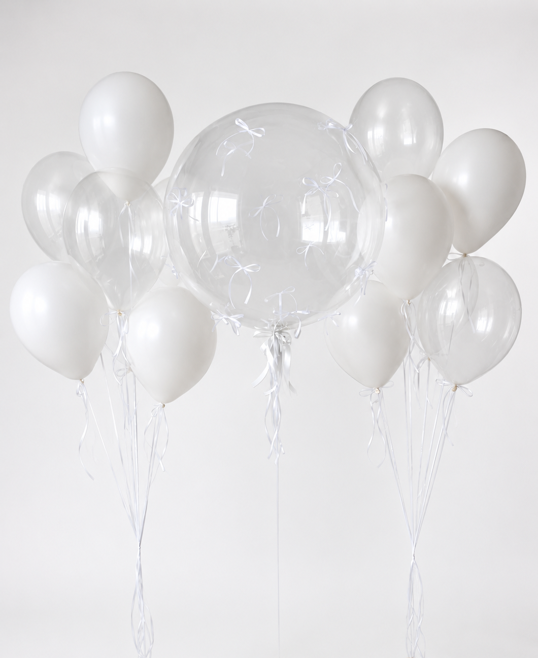 Bubble Balloon Set with Bows featuring a clear bubble balloon and two white balloon bunches for elegant celebration decor in Brooklyn