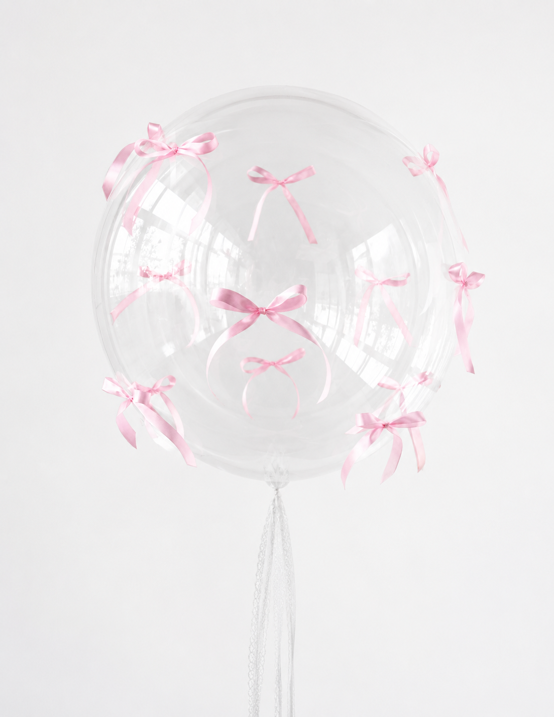 Bubble Balloon with Bows featuring a clear bubble balloon with blue ribbon bows for elegant celebration decor in Brooklyn