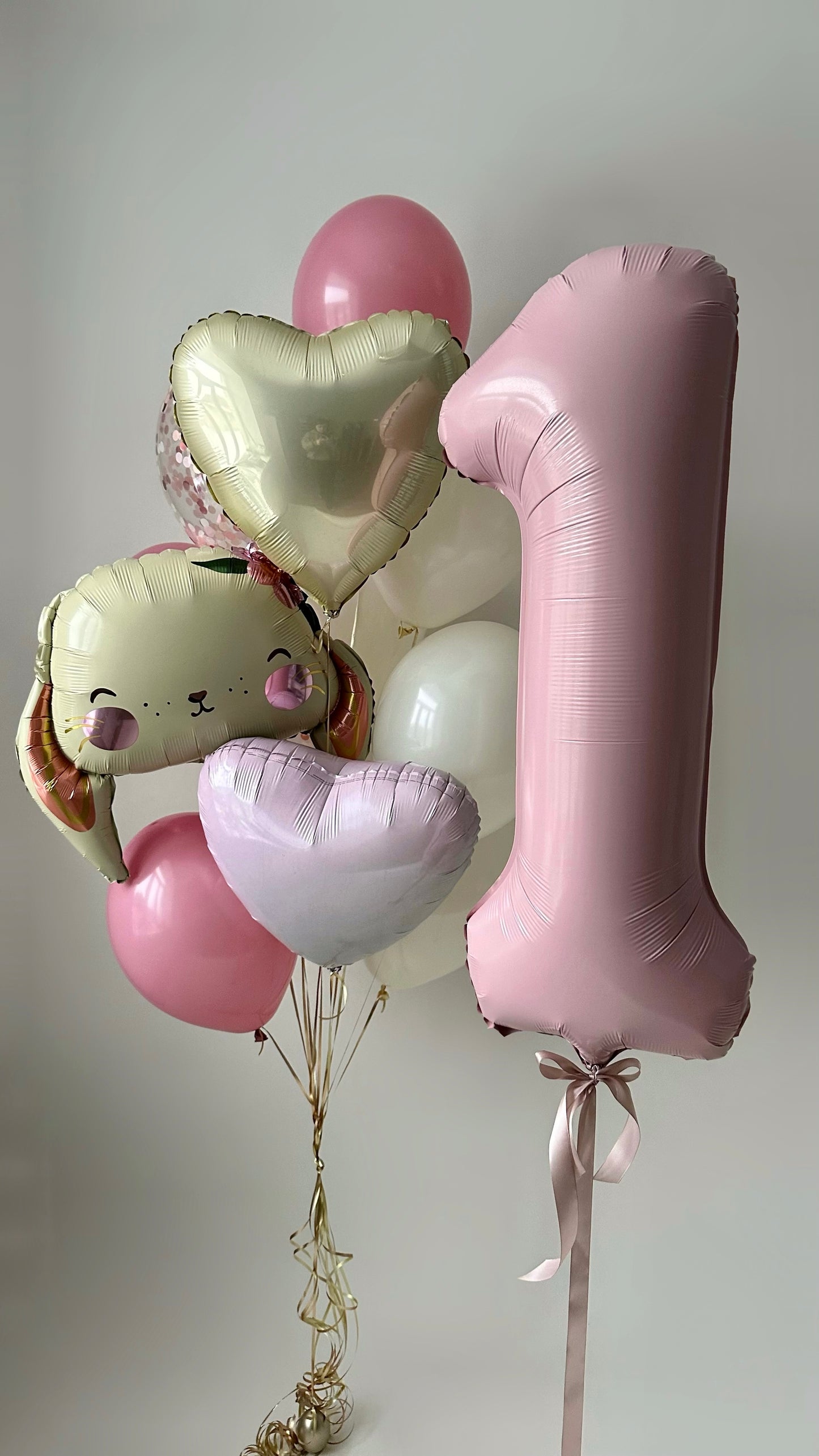 Bunny and Hearts First Birthday balloon set with pink number one balloon, bunny balloon, and heart balloons in New York