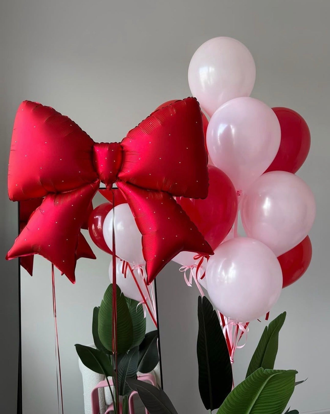 Candy bow balloon set with pearl bow balloon and pink red balloons for celebration decor in New York