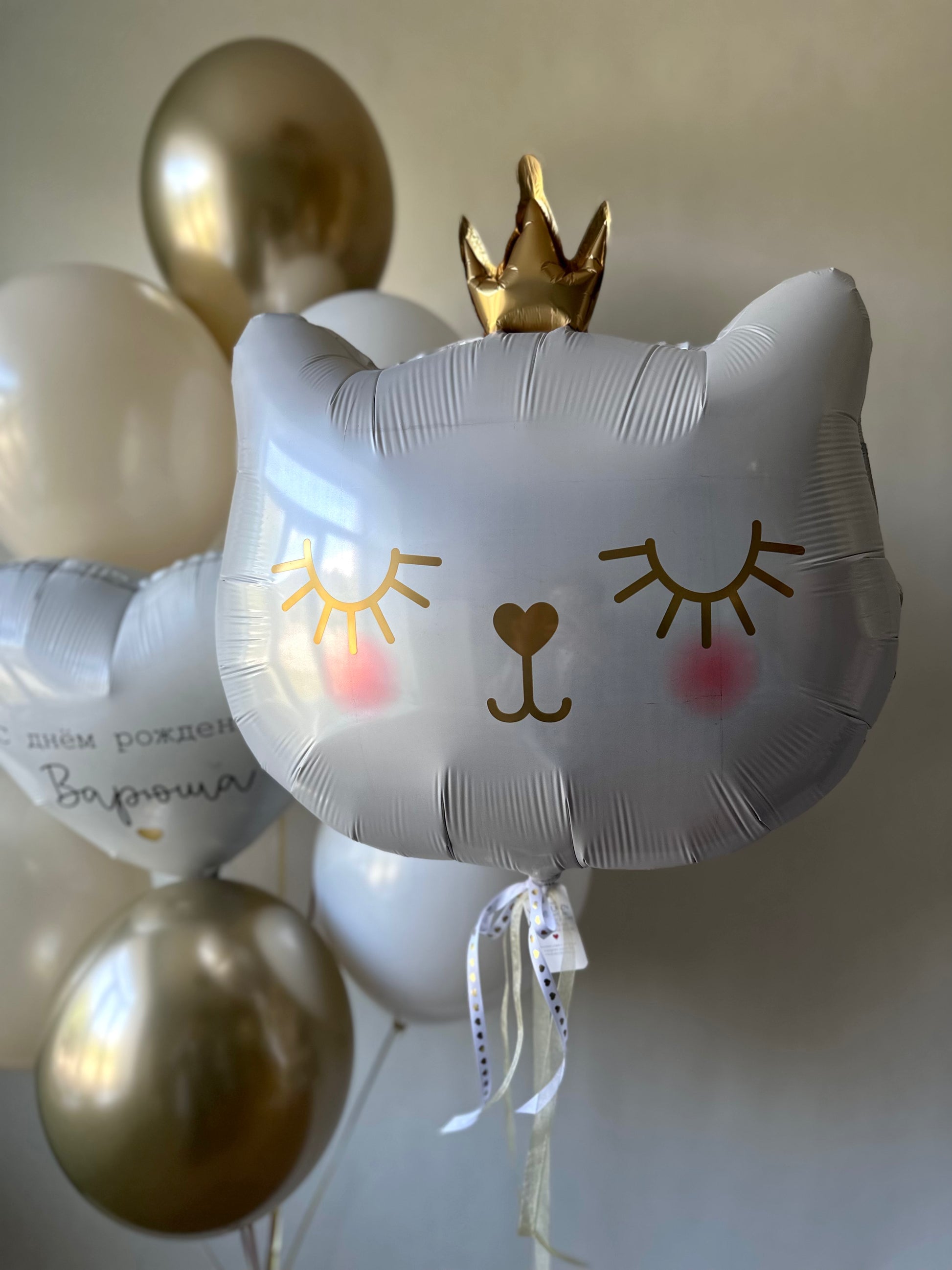 Close-up of cat crown balloon with personalized heart balloon for girls birthday decor in Brooklyn