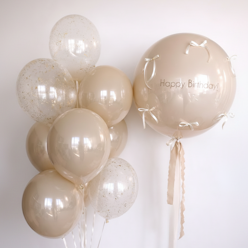 Champagne Wishes Balloon Set with custom bubble balloon with bows and matching bunch of glass-effect and gold flake balloons