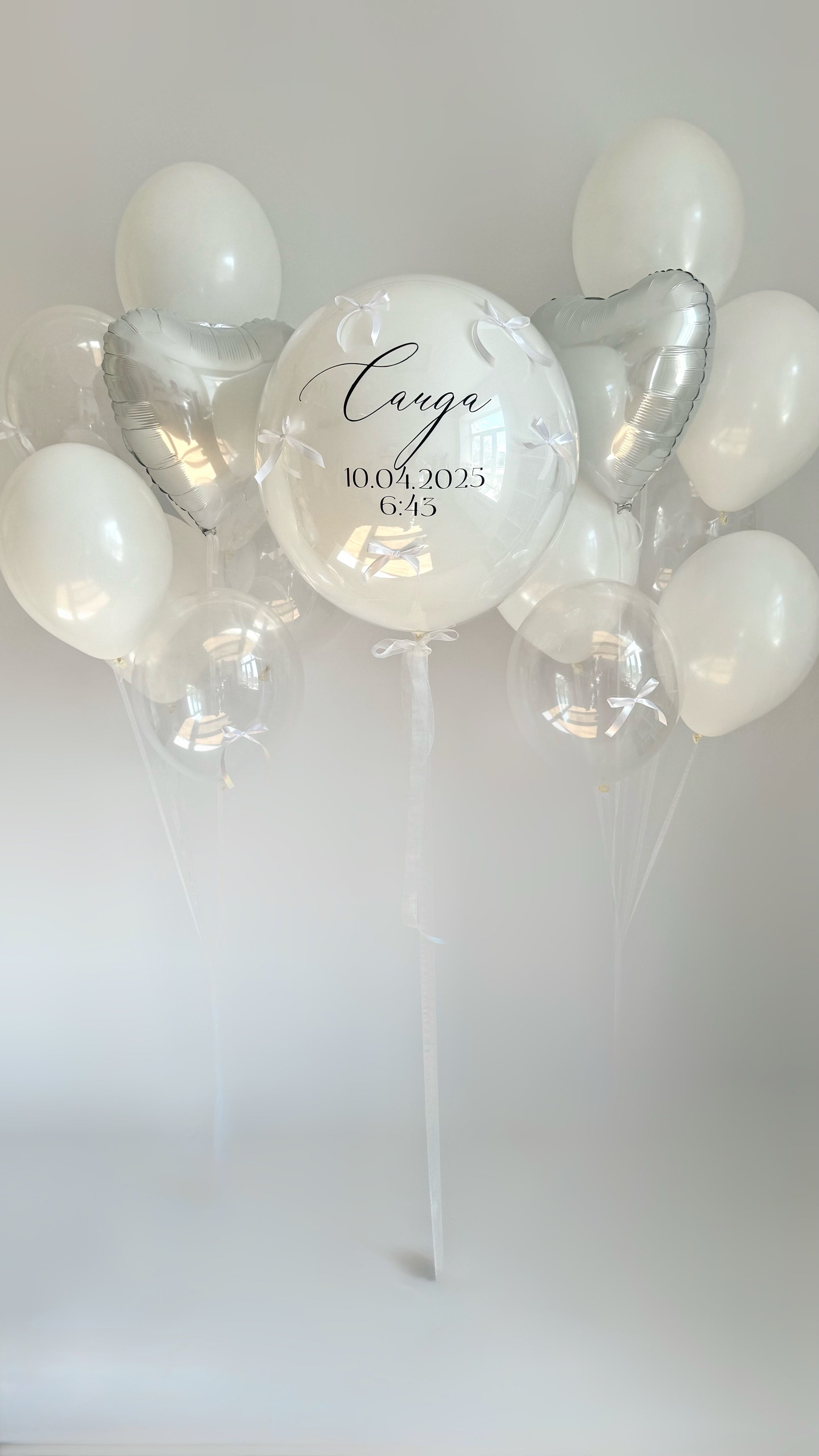Clear welcome balloon set with custom double bubble balloon, white heart balloons, and elegant welcome decor in New York