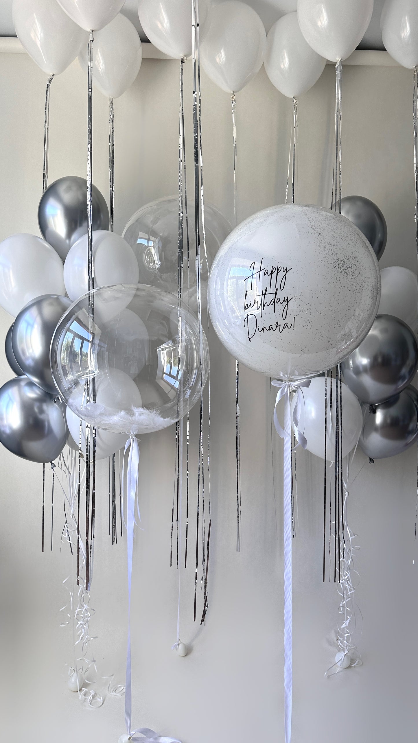 Crystal White Celebration balloon set with personalized double bubble balloon and white silver balloon decor in New York