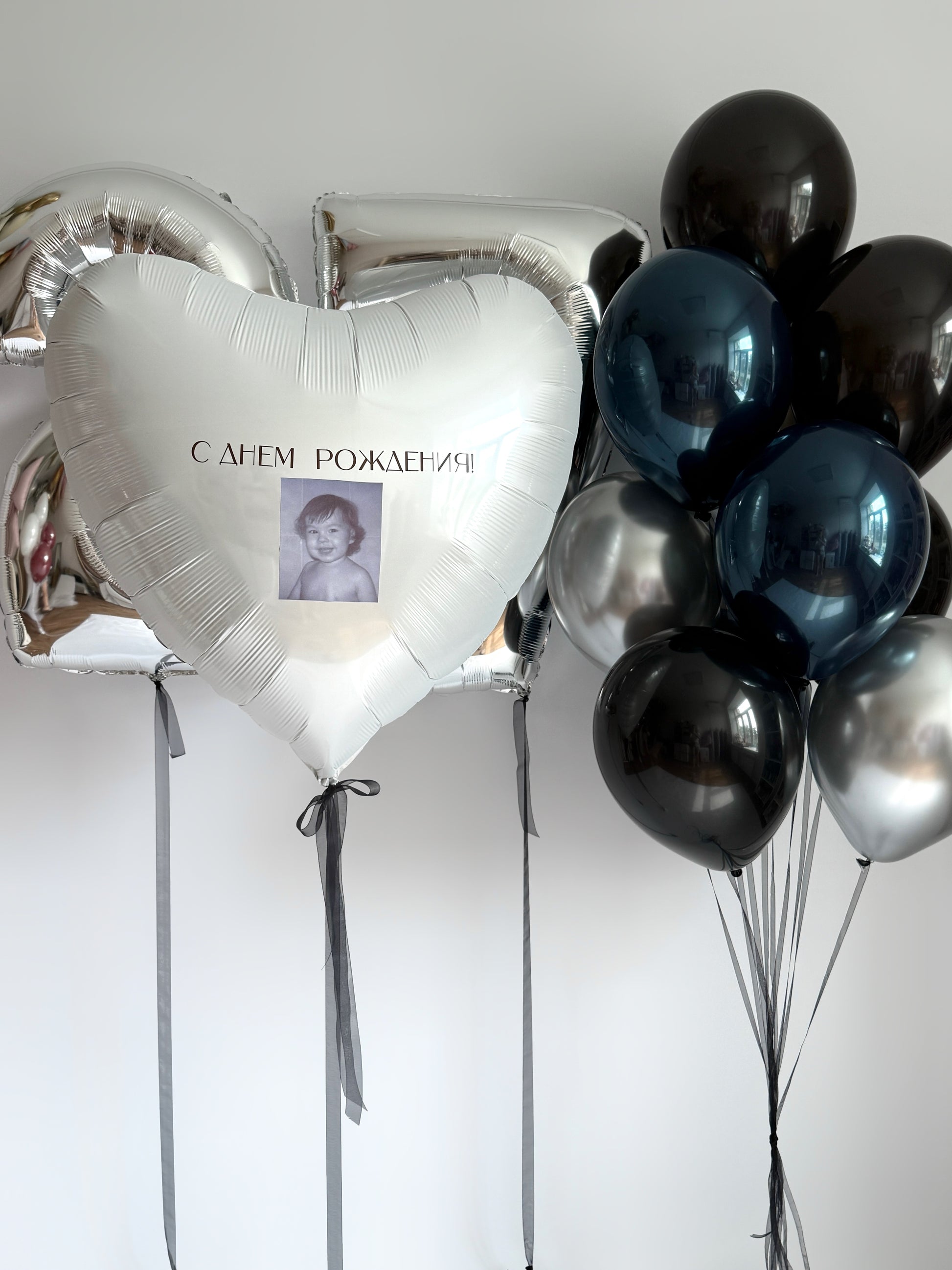 Deep ocean birthday balloon set with photo heart balloon, number balloons, and blue black silver decor in New York