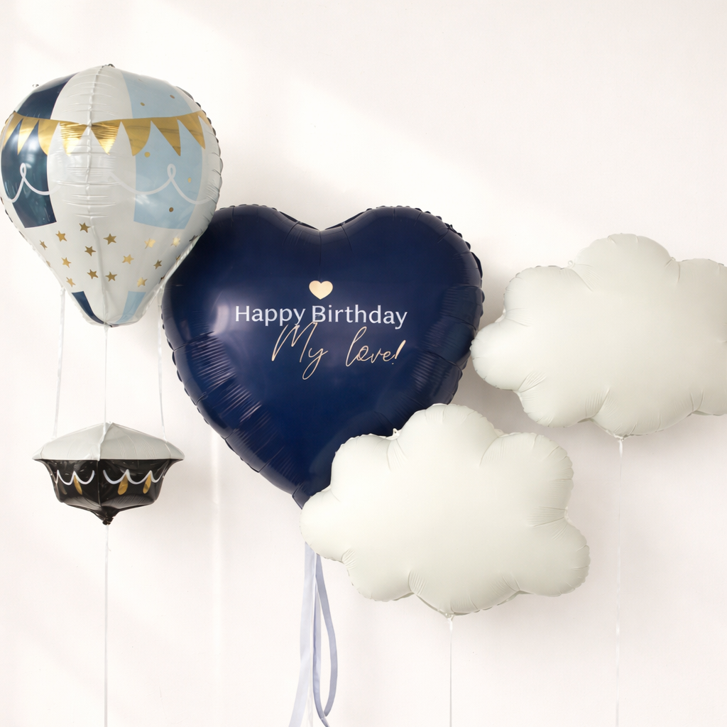 Dream Flight Balloon Set with custom navy heart balloon, hot air balloon, and white cloud balloons for celebration decor in Brooklyn
