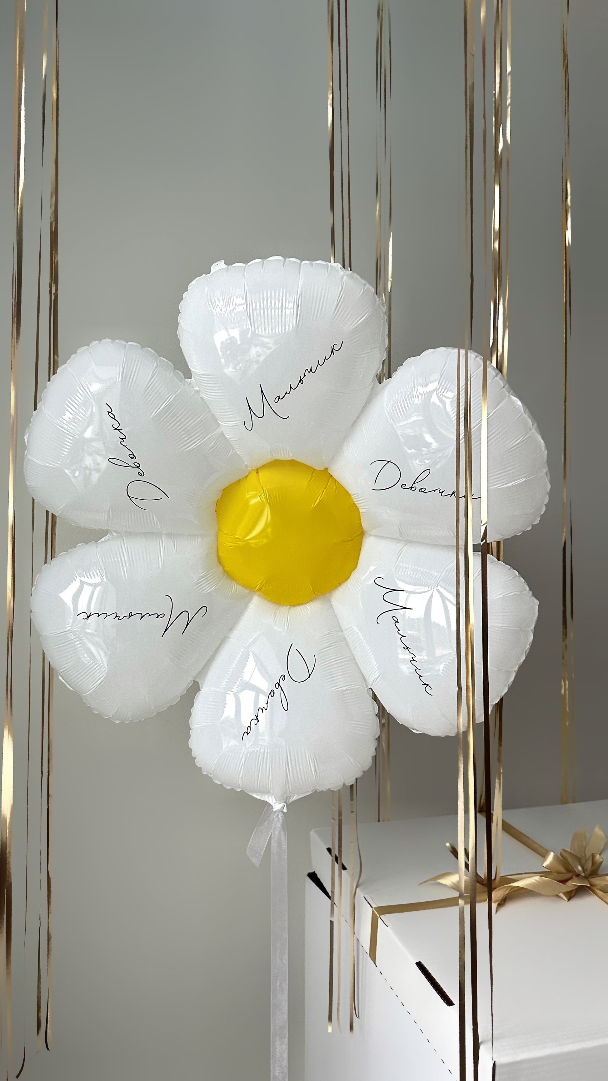 White and gold gender reveal balloon decor with floating reveal box setup in Manhattan