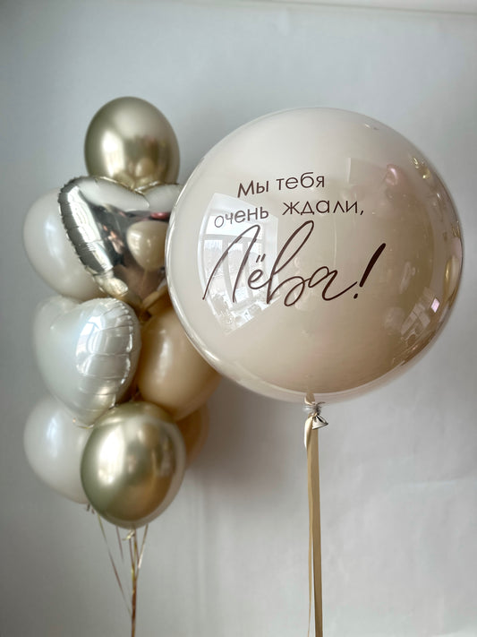 Golden welcome balloon set with custom sign bubble balloon and gold heart balloons for baby celebration decor in New York