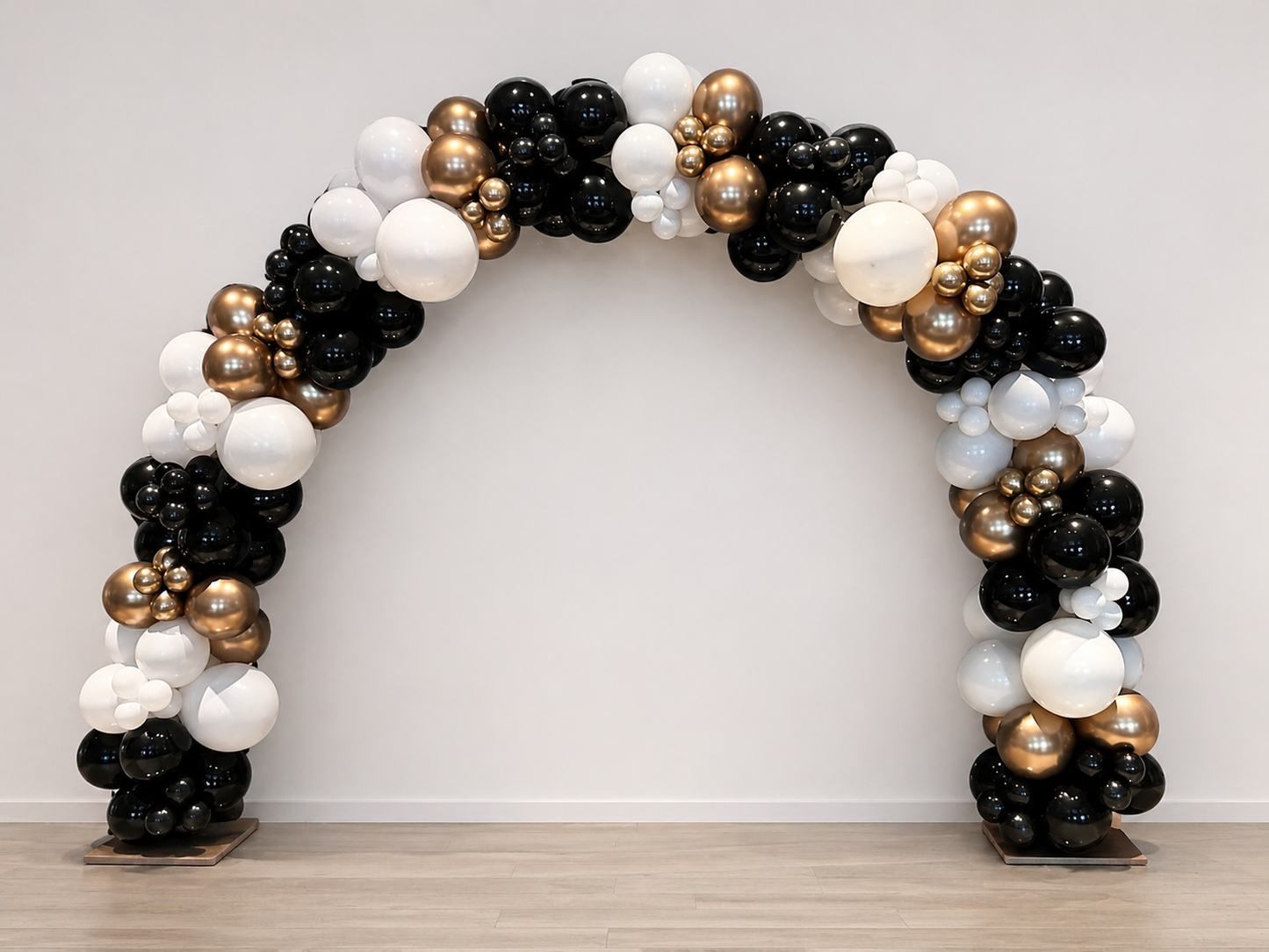 Graduation Balloon Arch with black, white, and gold balloons for graduation event decor in Queens