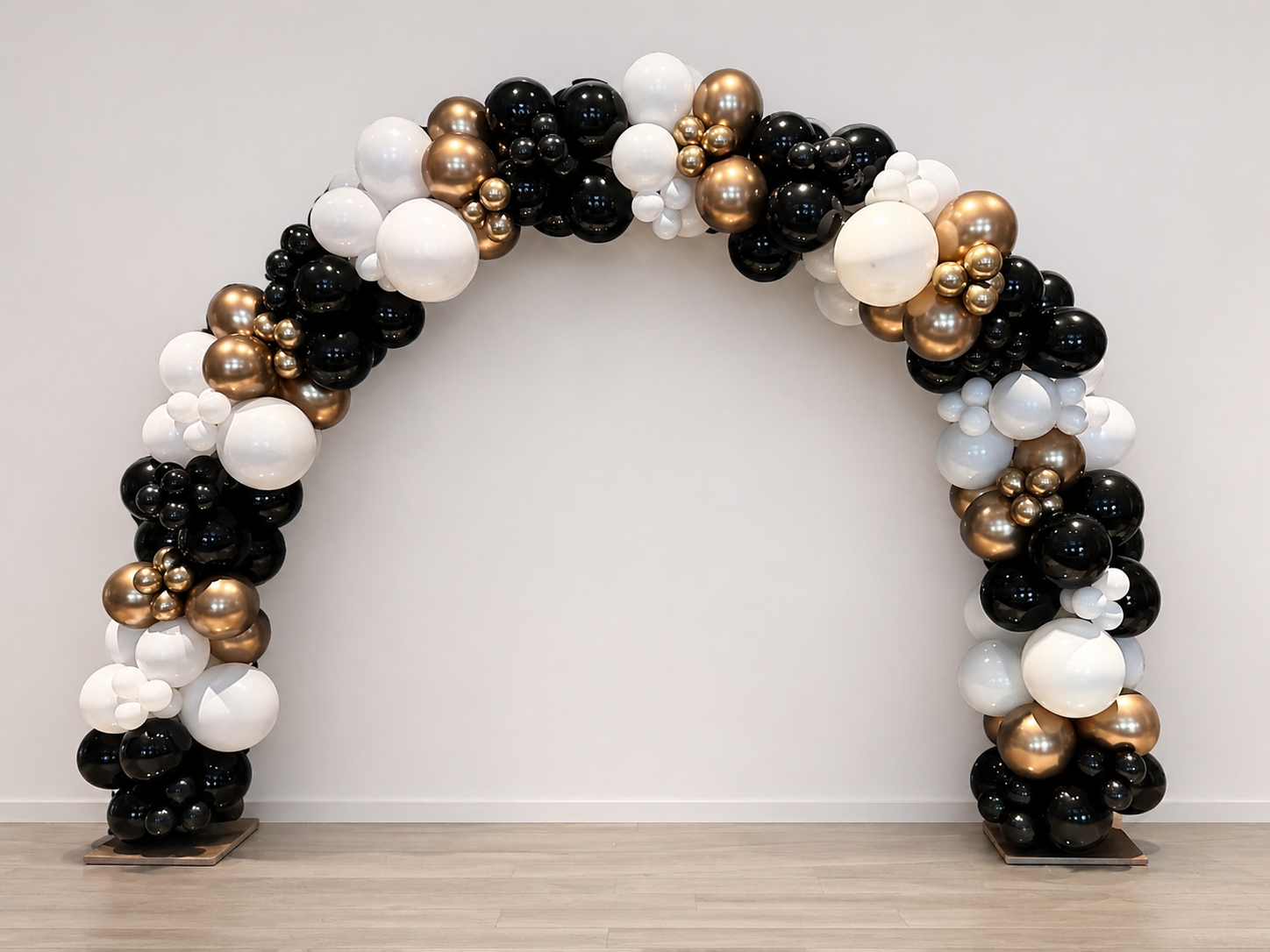 Graduation Balloon Arch with black, white, and gold balloons for graduation event decor in Queens