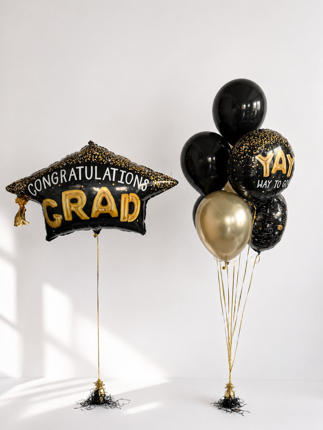 Graduation Balloon Set with one large graduation balloon, four latex balloons, and two themed foil balloons for graduation decor in Manhattan